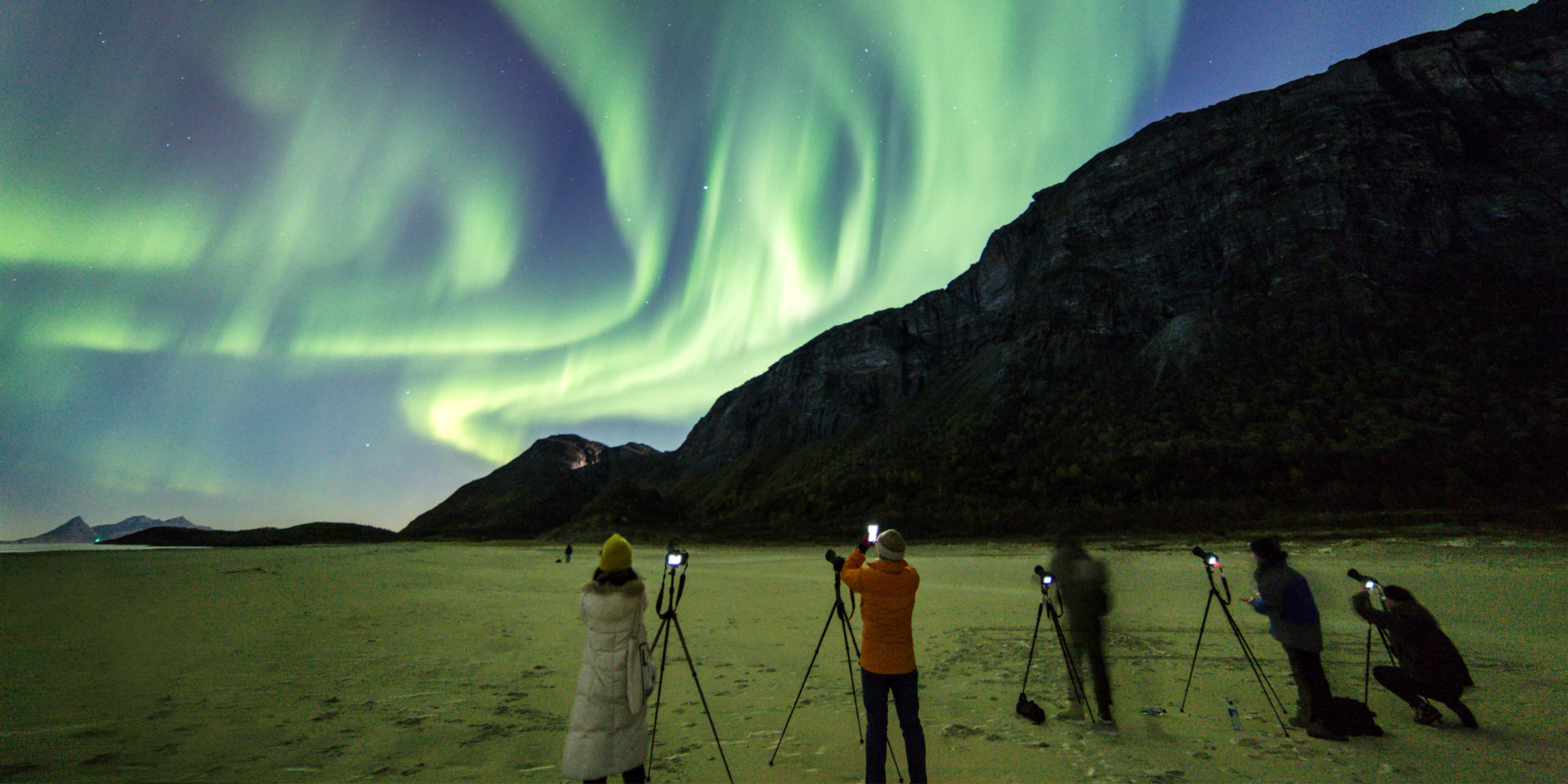 People learning how to photograph the northern lights in Gildeskål, Northern Norway