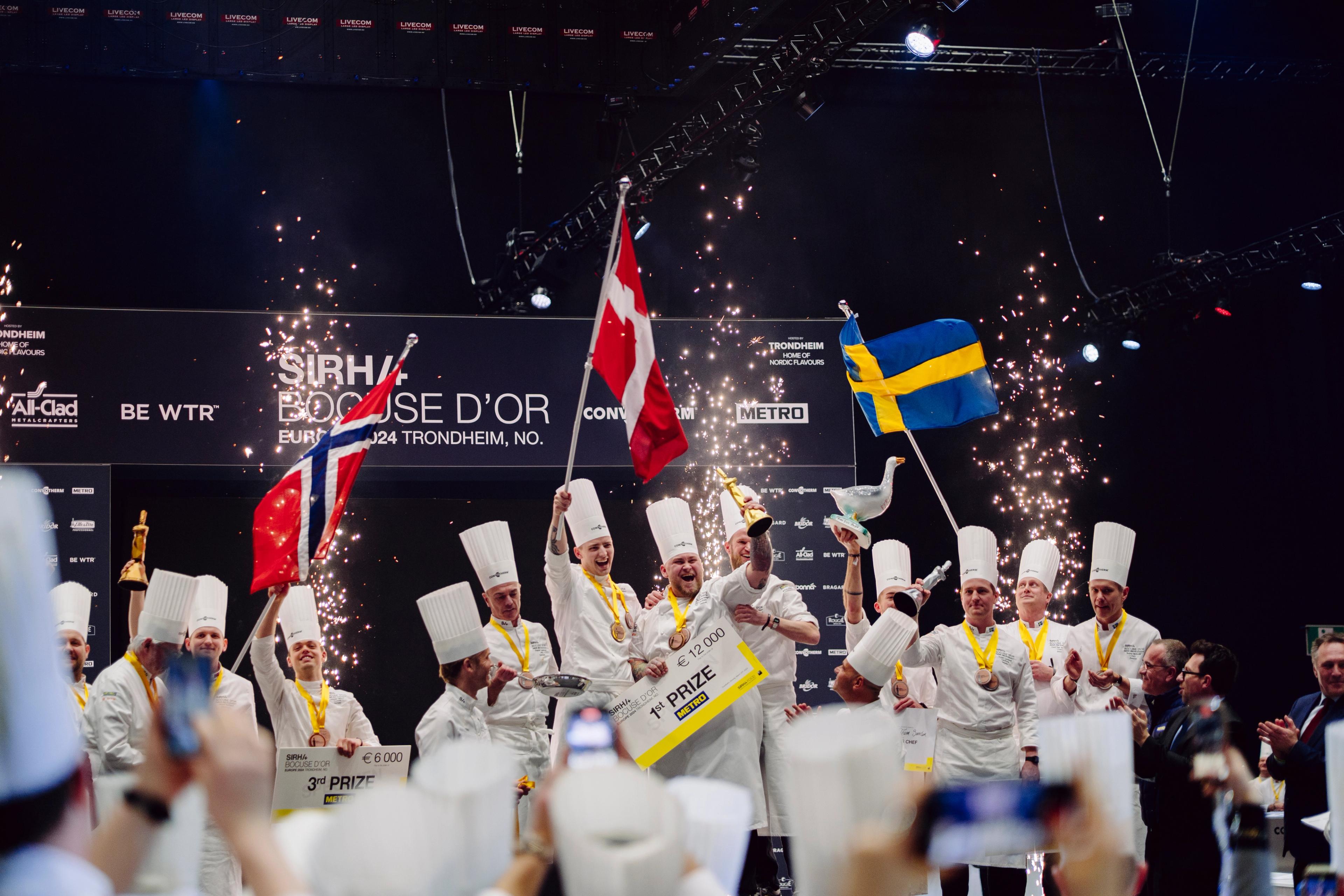 The Norwegian, Danish and Swedish team celebrating on the podium.