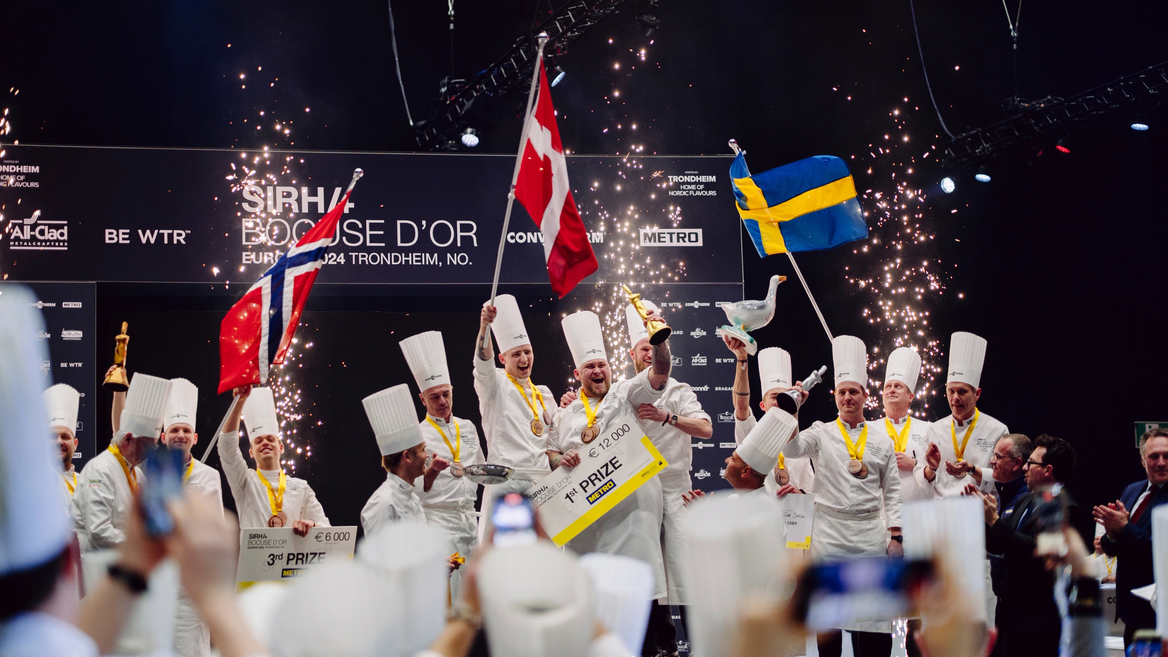 The Norwegian, Danish and Swedish team celebrating on the podium.