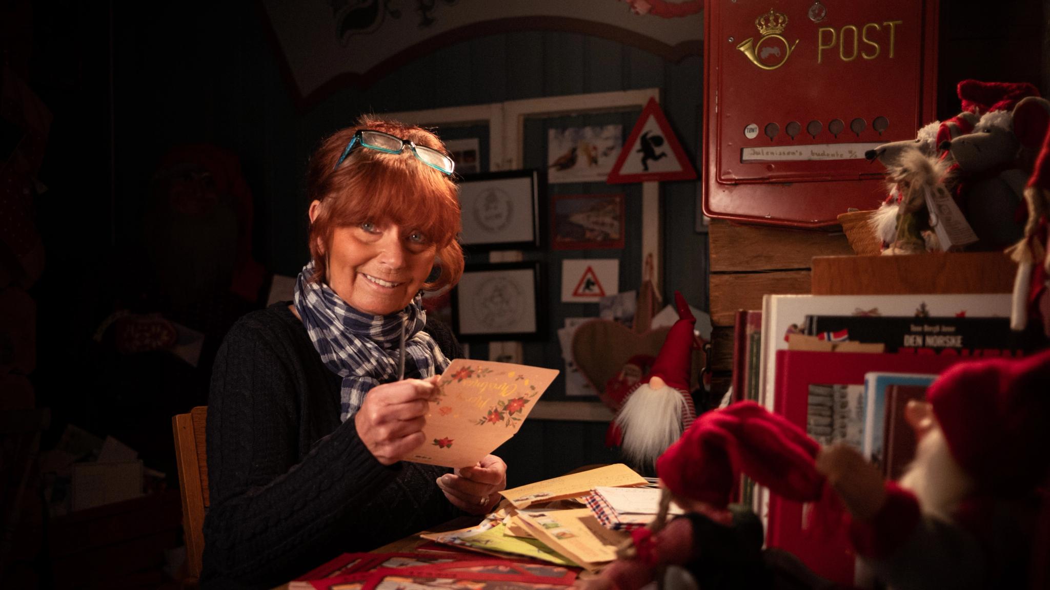 A Woman opening letter at Santa´s Post Office in Drøbak.