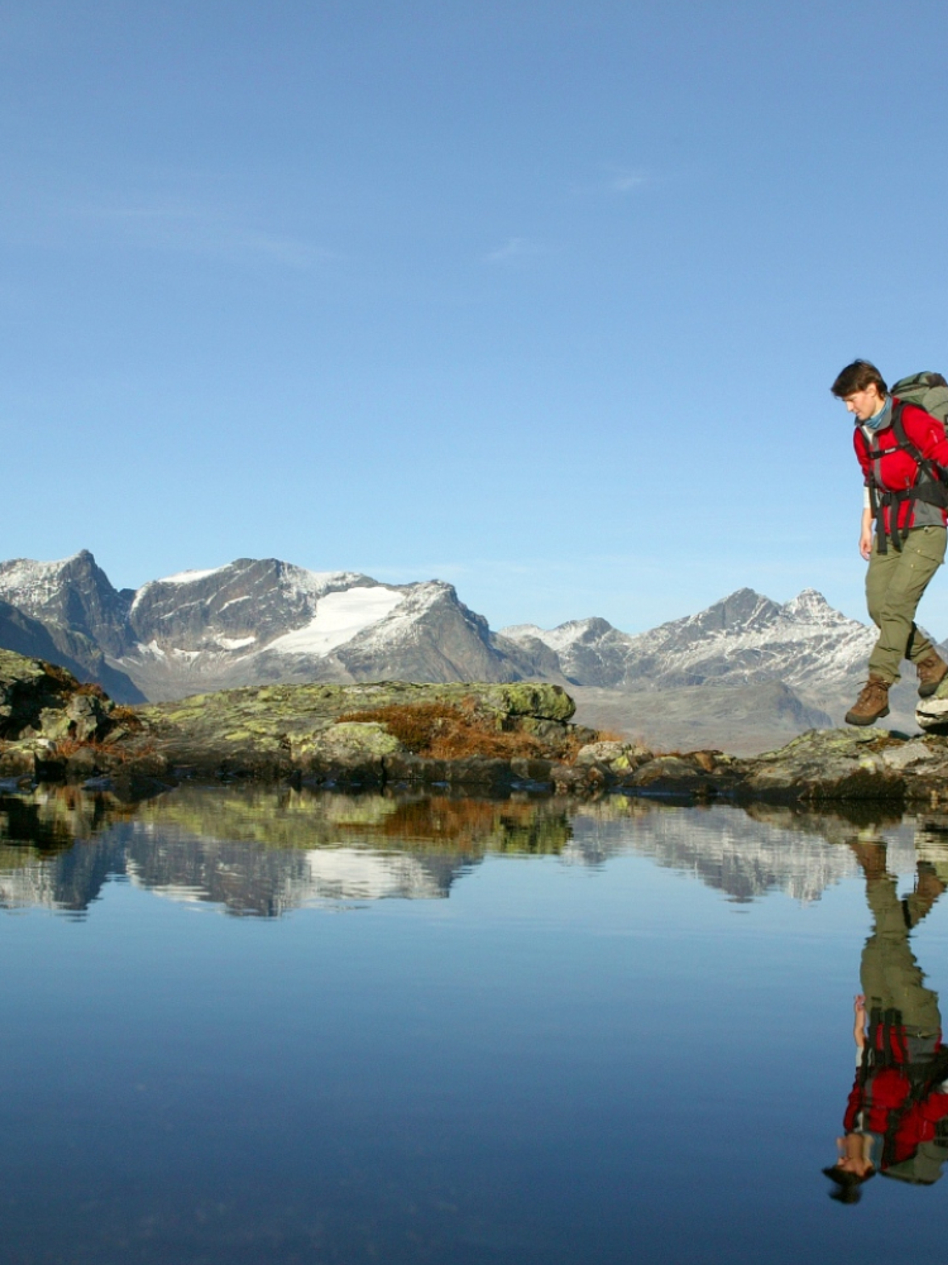 Woman walking the Besseggen ridge in Valdres