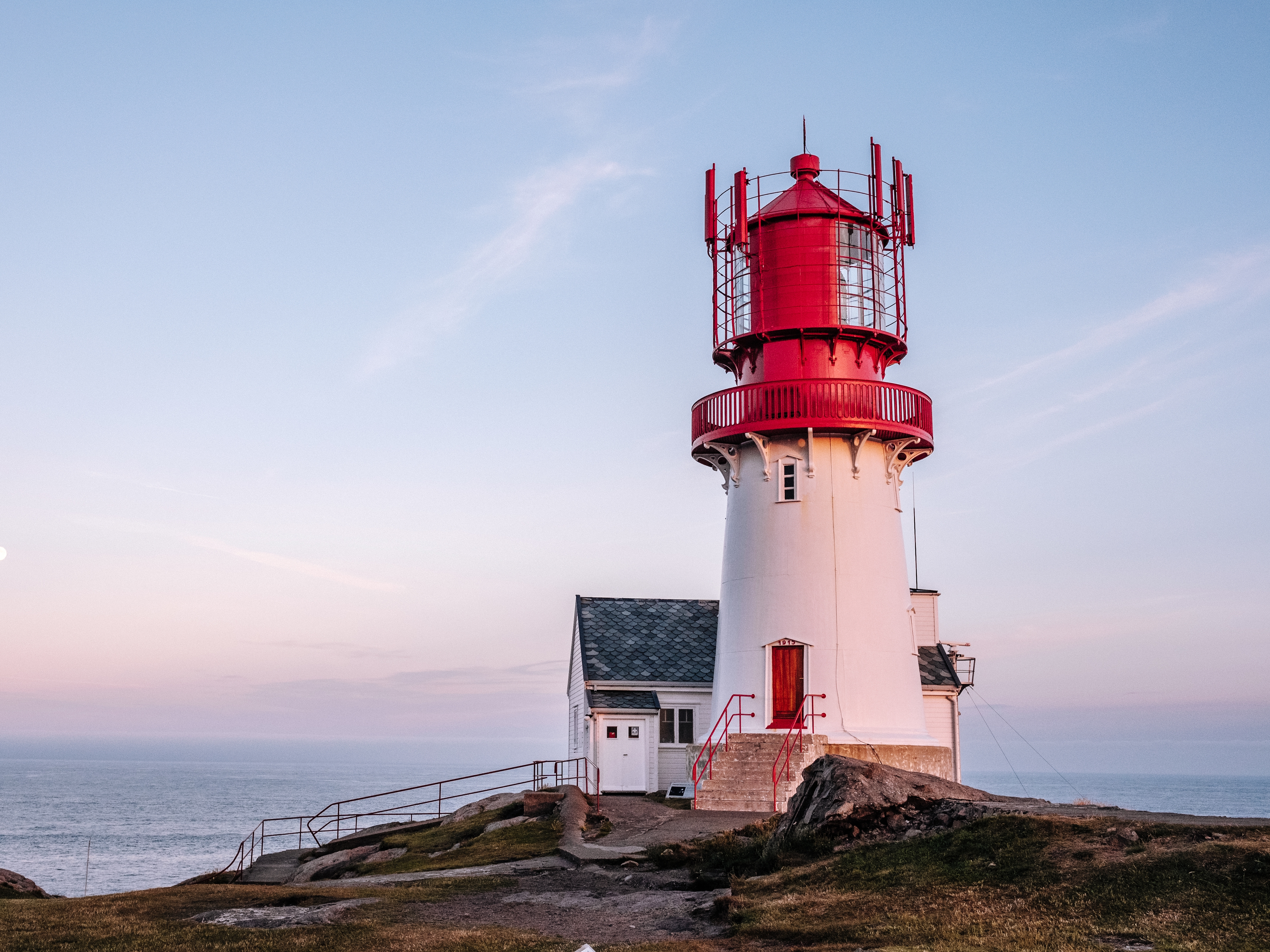 Lindesnes lighthouse in Southern Norway during sunset.