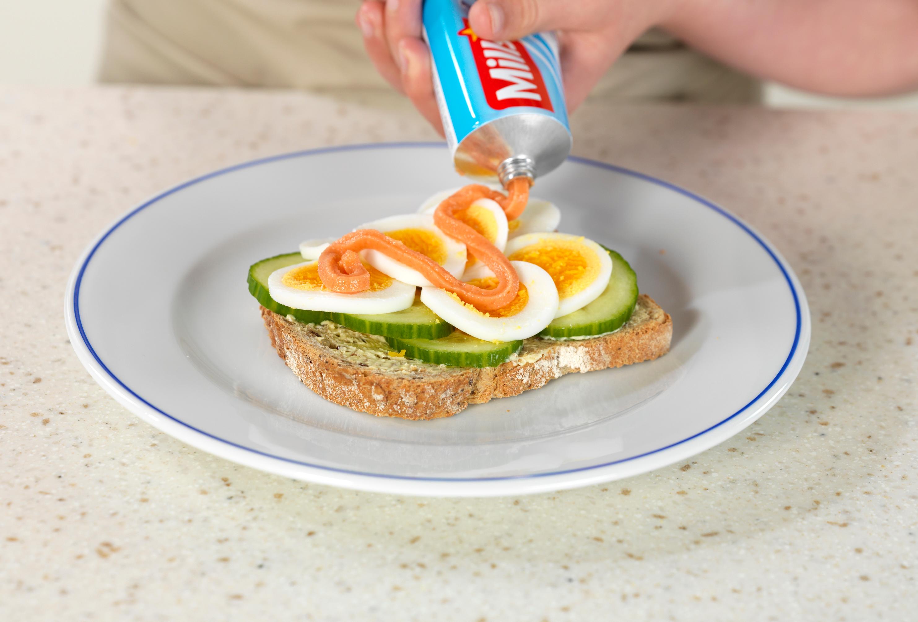 Norwegian caviar, or smoked cod roe, on tube, used as topping on a slice of bread with eggs