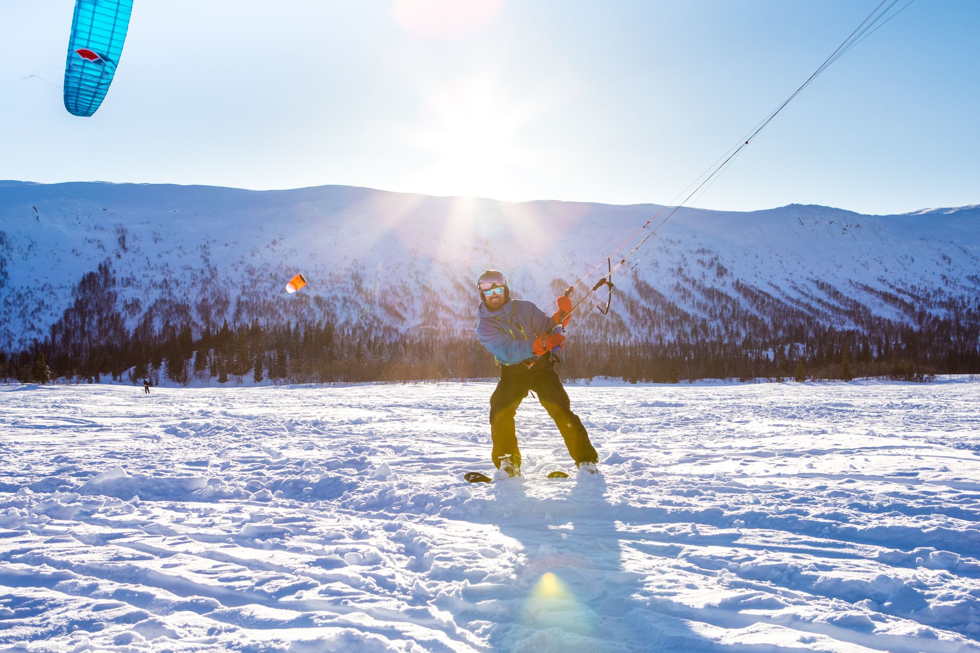 A person snowkiting in Namsskogan in the Trøndelag region of Norway