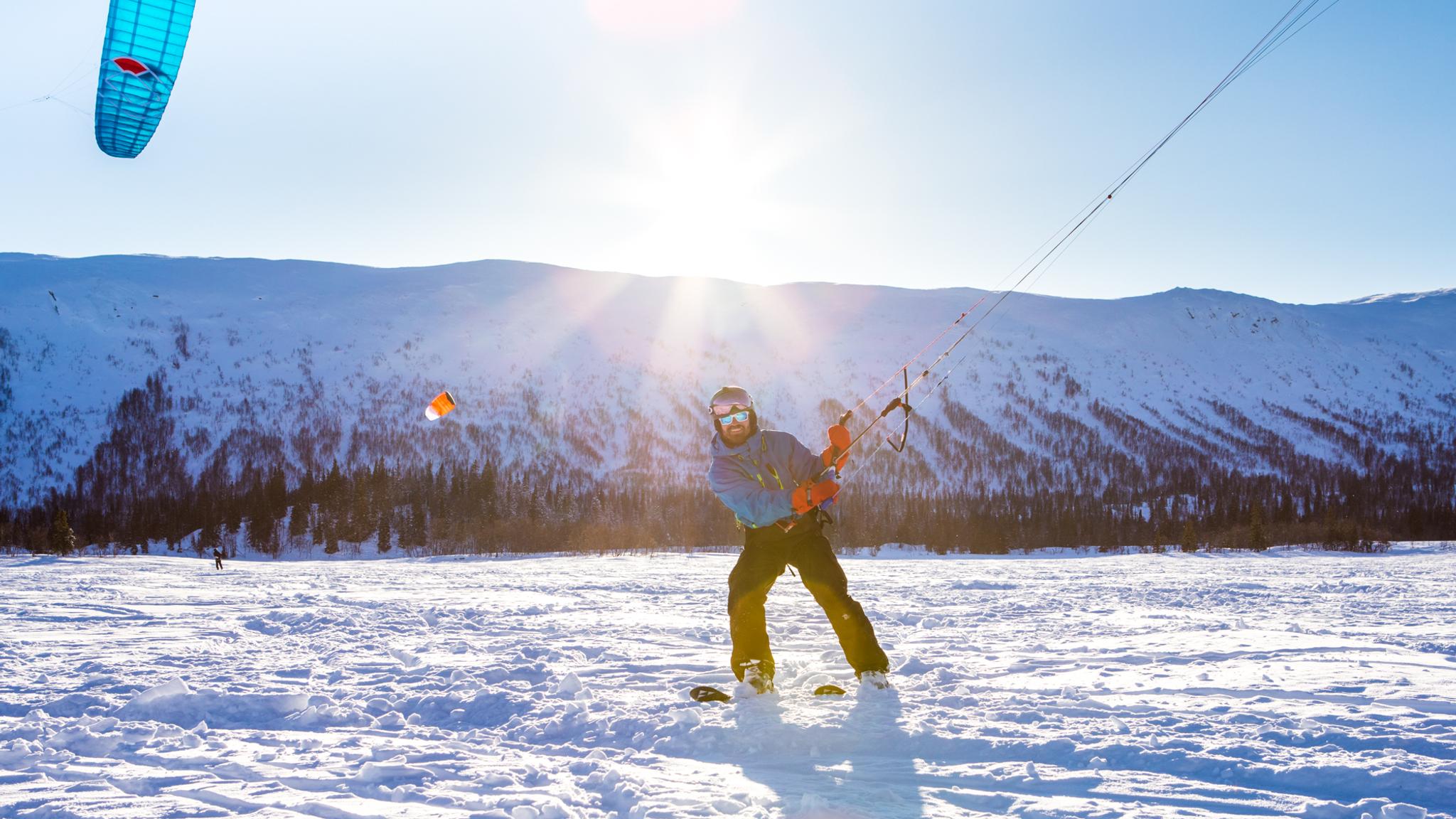 A person snowkiting in Namsskogan in the Trøndelag region of Norway