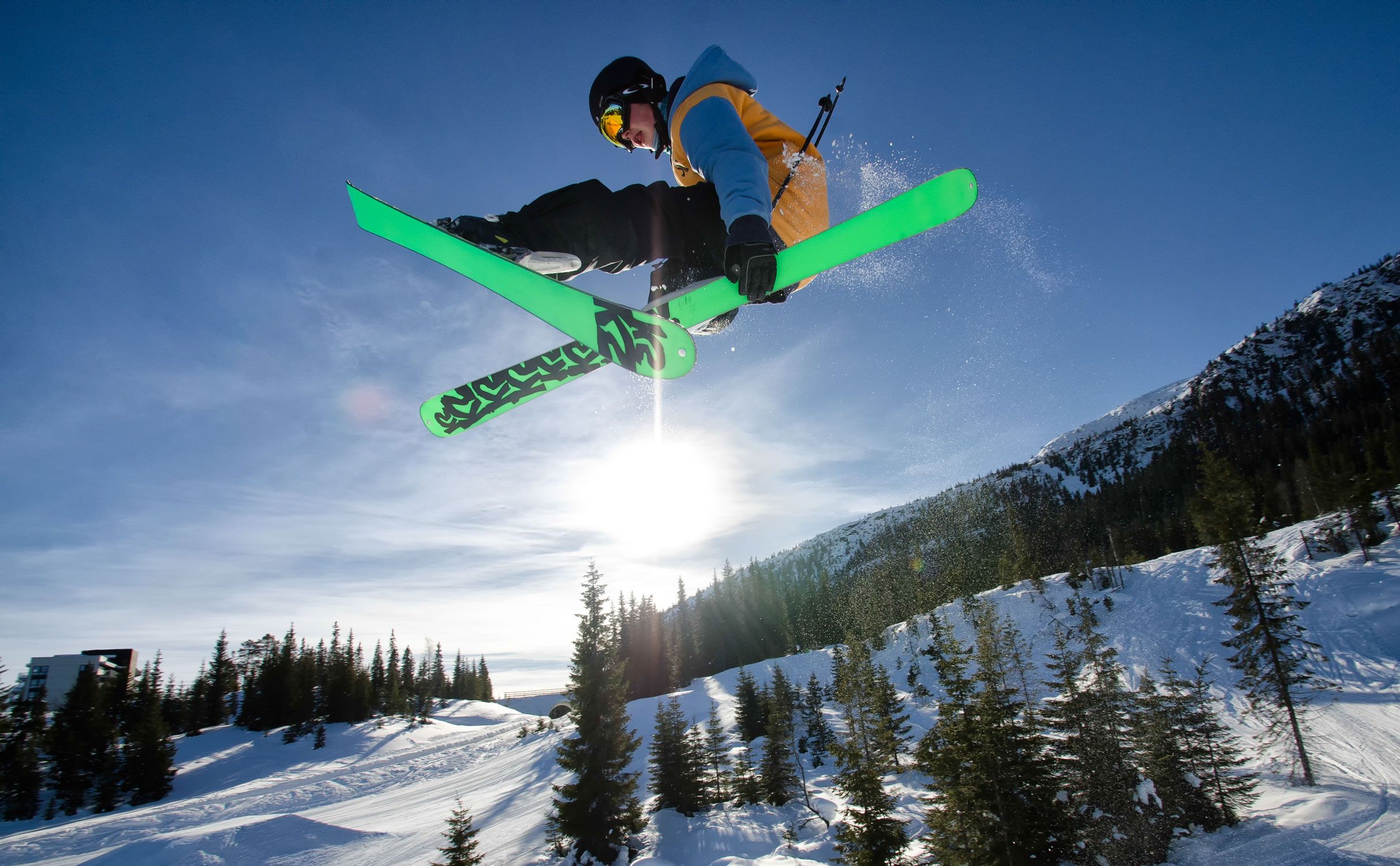 Alpine skier jumping high in the air at Kvitfjell, Eastern Norway
