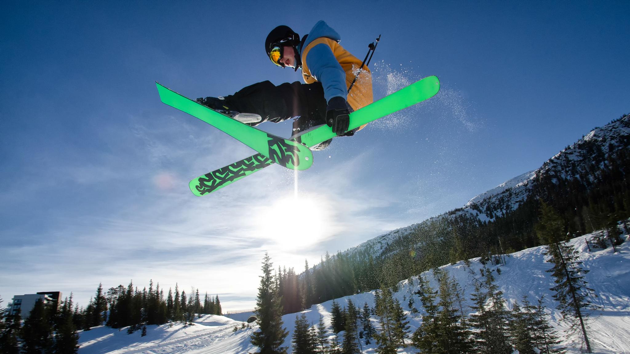 Alpine skier jumping high in the air at Kvitfjell, Eastern Norway