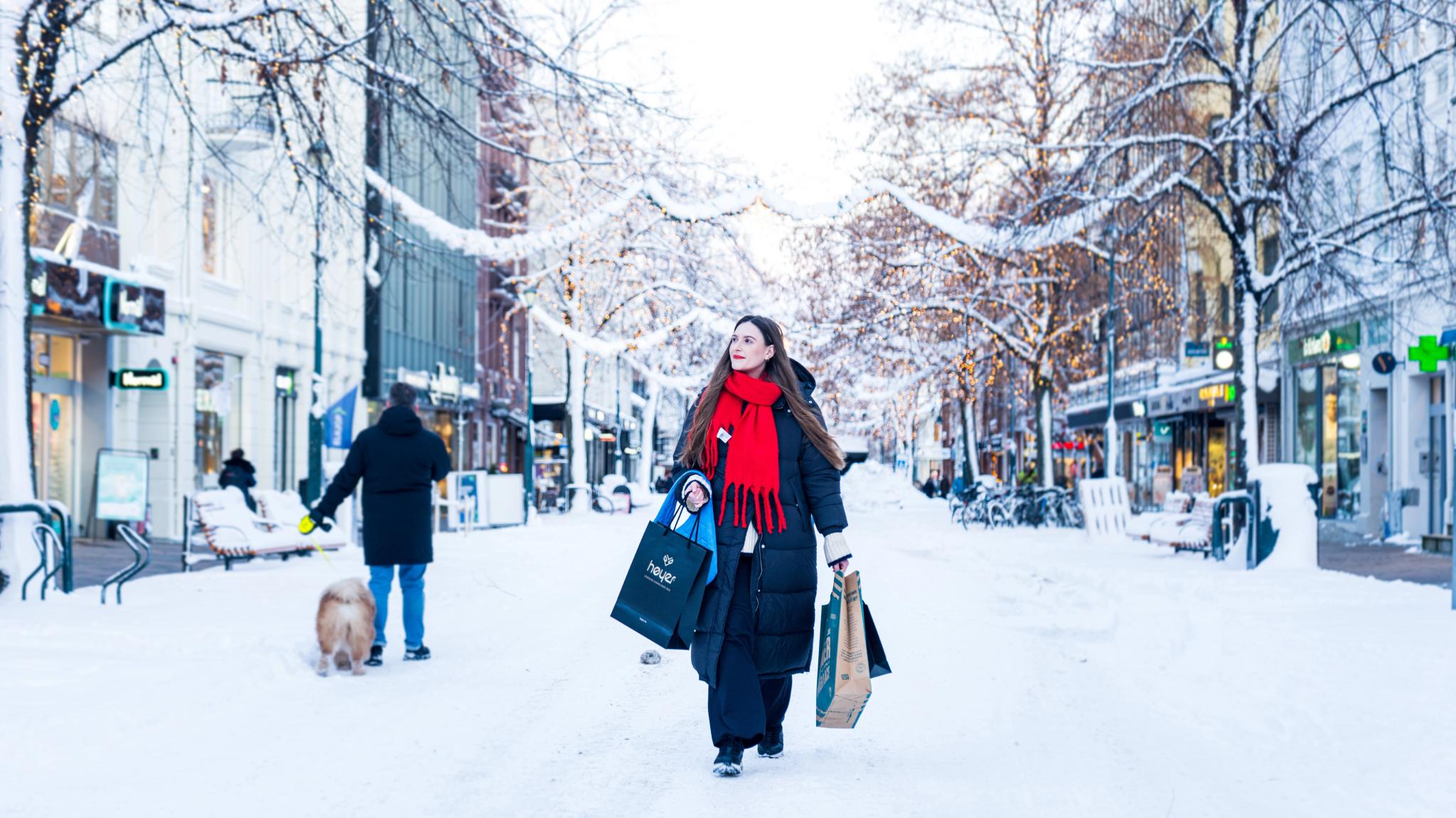 A women on Christmas shopping in Midtbyen in Trondheim city centre, Trøndelag, Norway.
