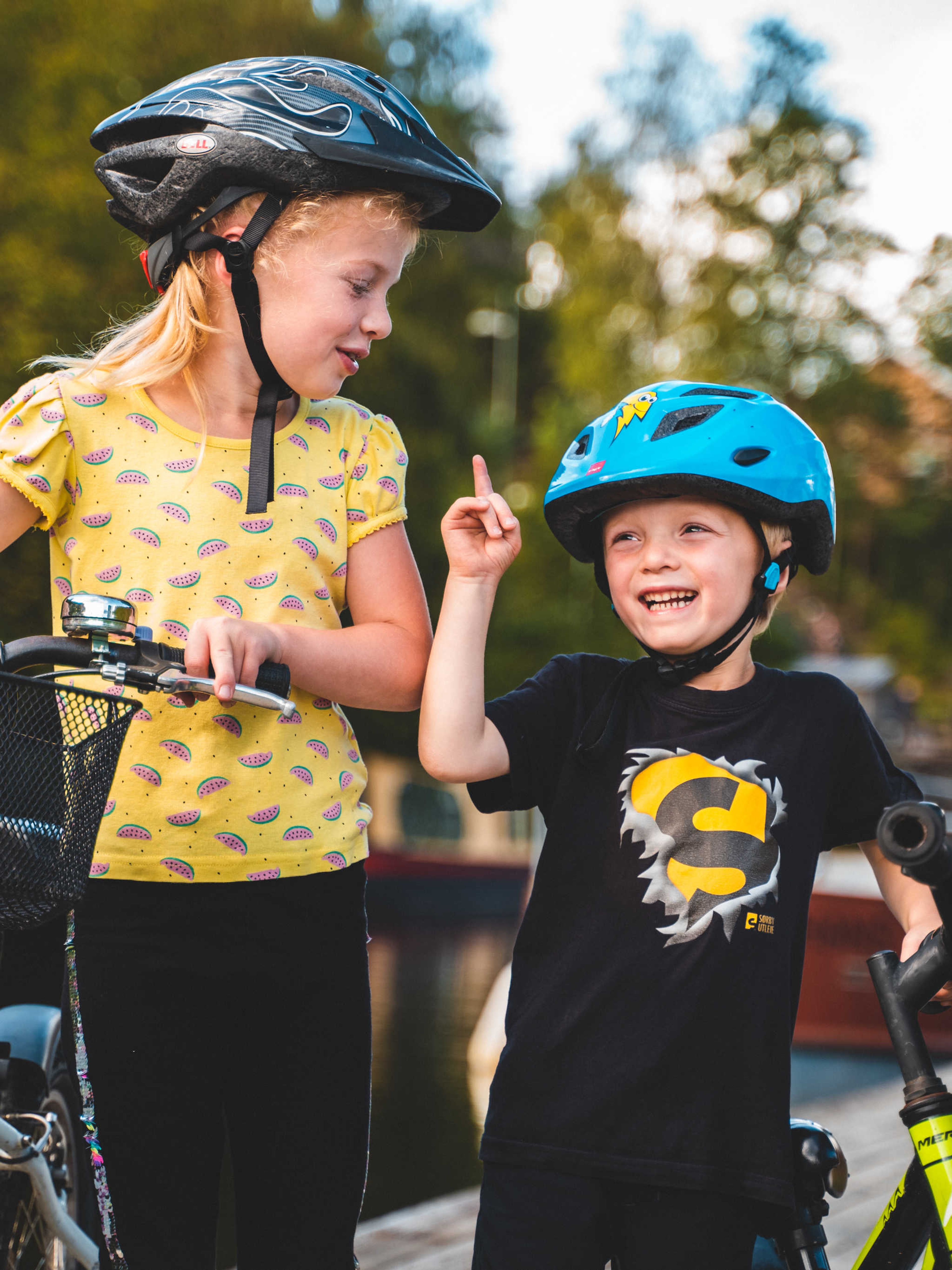 Kids biking along the Halden Canal in Eastern Norway.