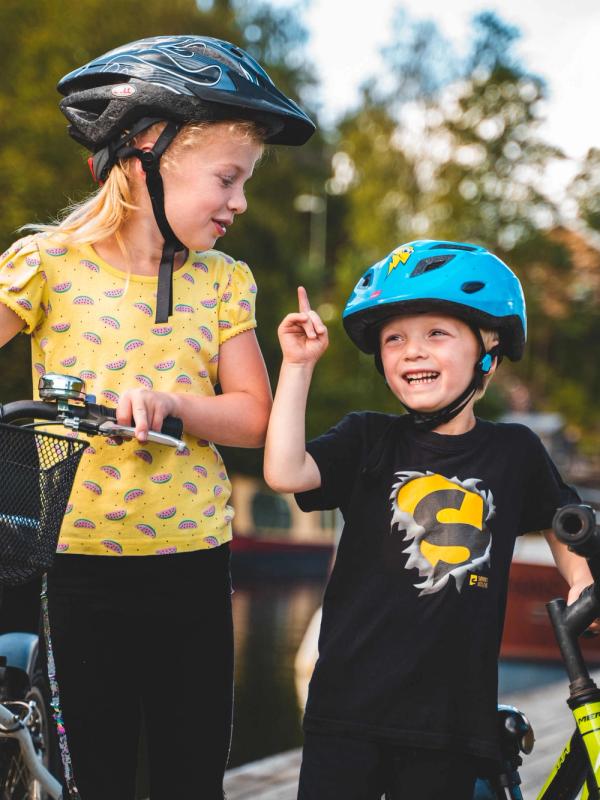 Kids biking along the Halden Canal in Eastern Norway.