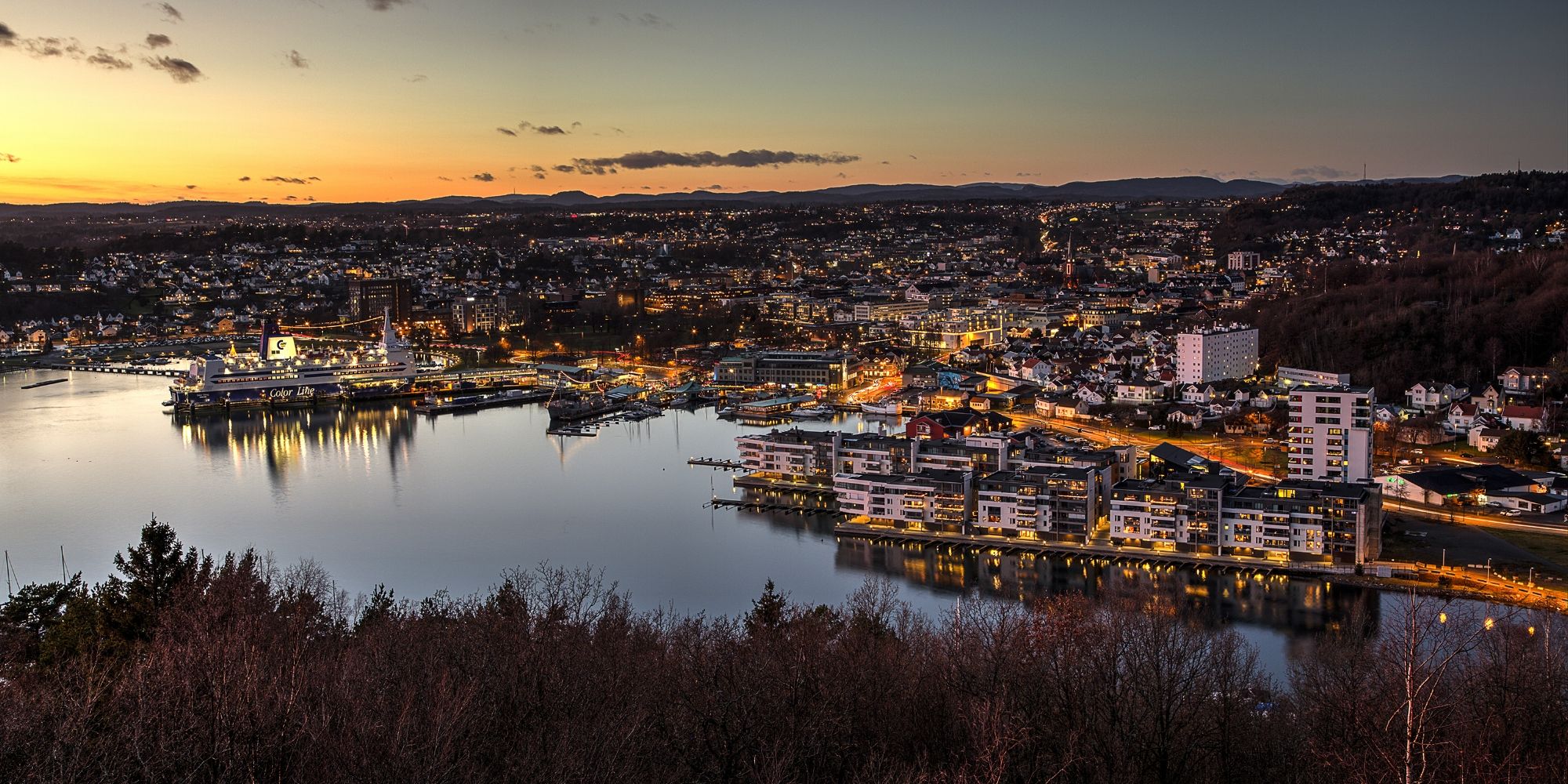 Sandefjord, and the surrounding fjord, seen from a distance at night time