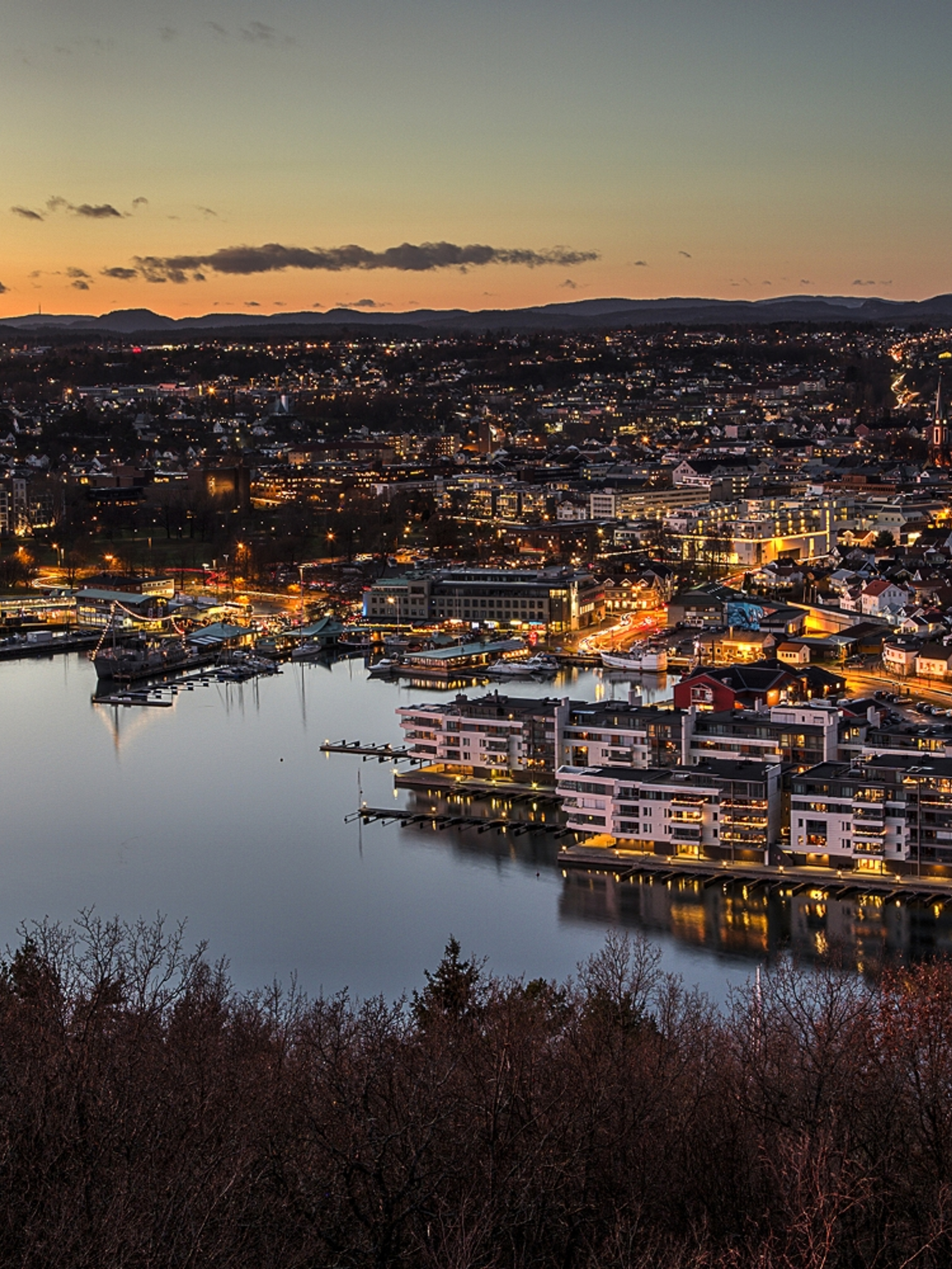 Sandefjord, and the surrounding fjord, seen from a distance at night time