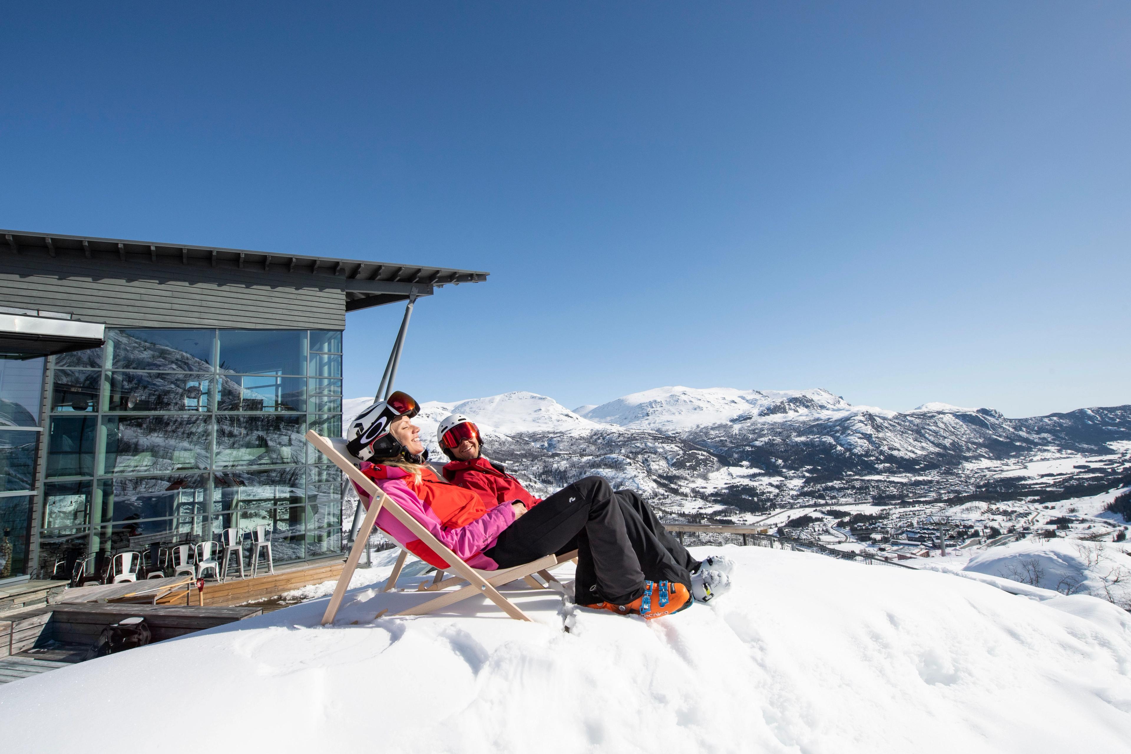 Two people taking a break from skiing in Hemsedal, Eastern Norway