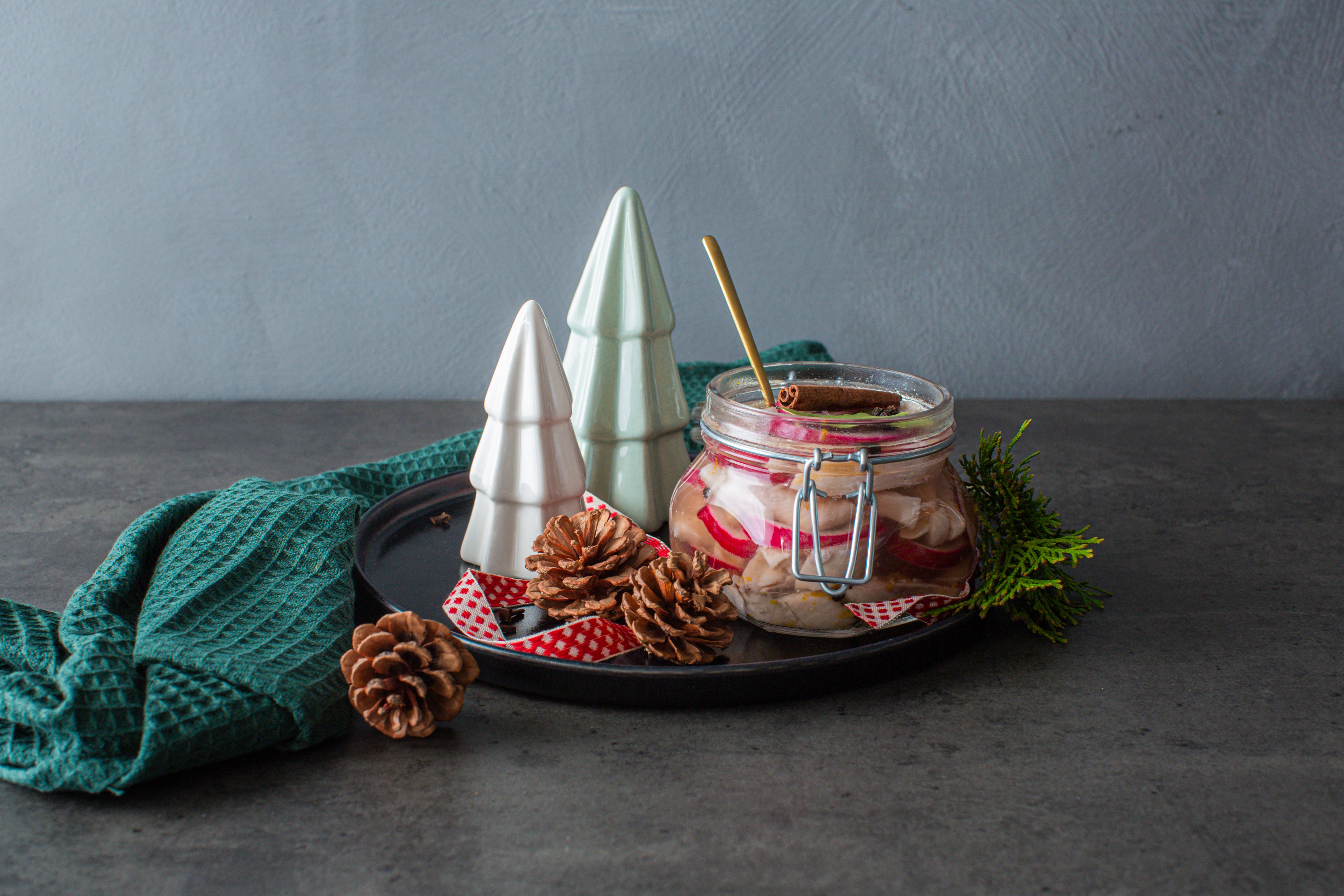Traditional Norwegian pickled herring in a glass jar