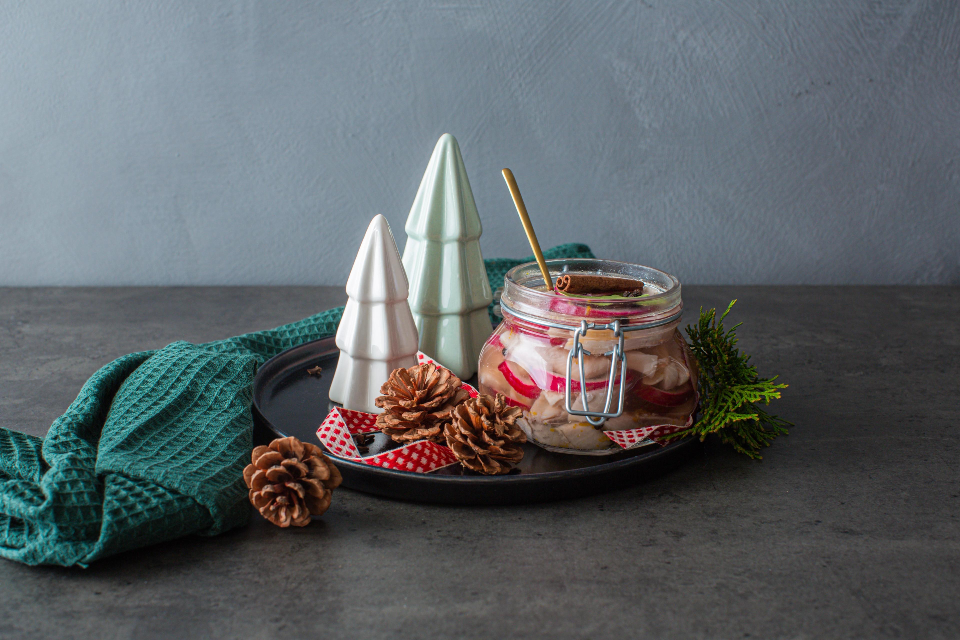 Traditional Norwegian pickled herring in a glass jar