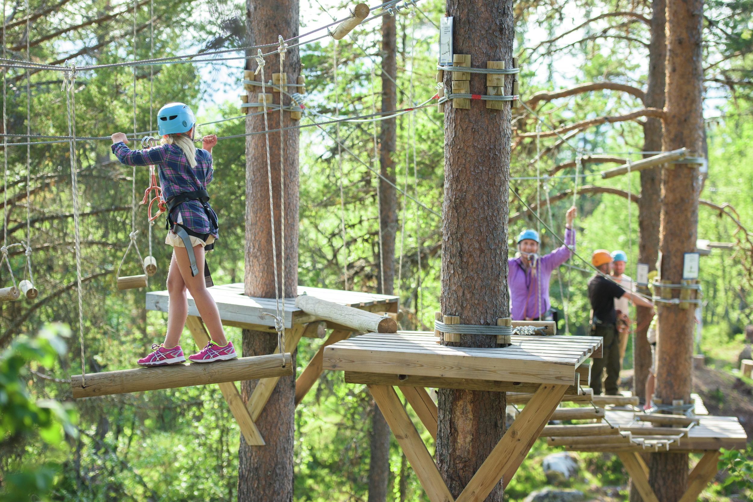 A girl enjoying the climbing park
