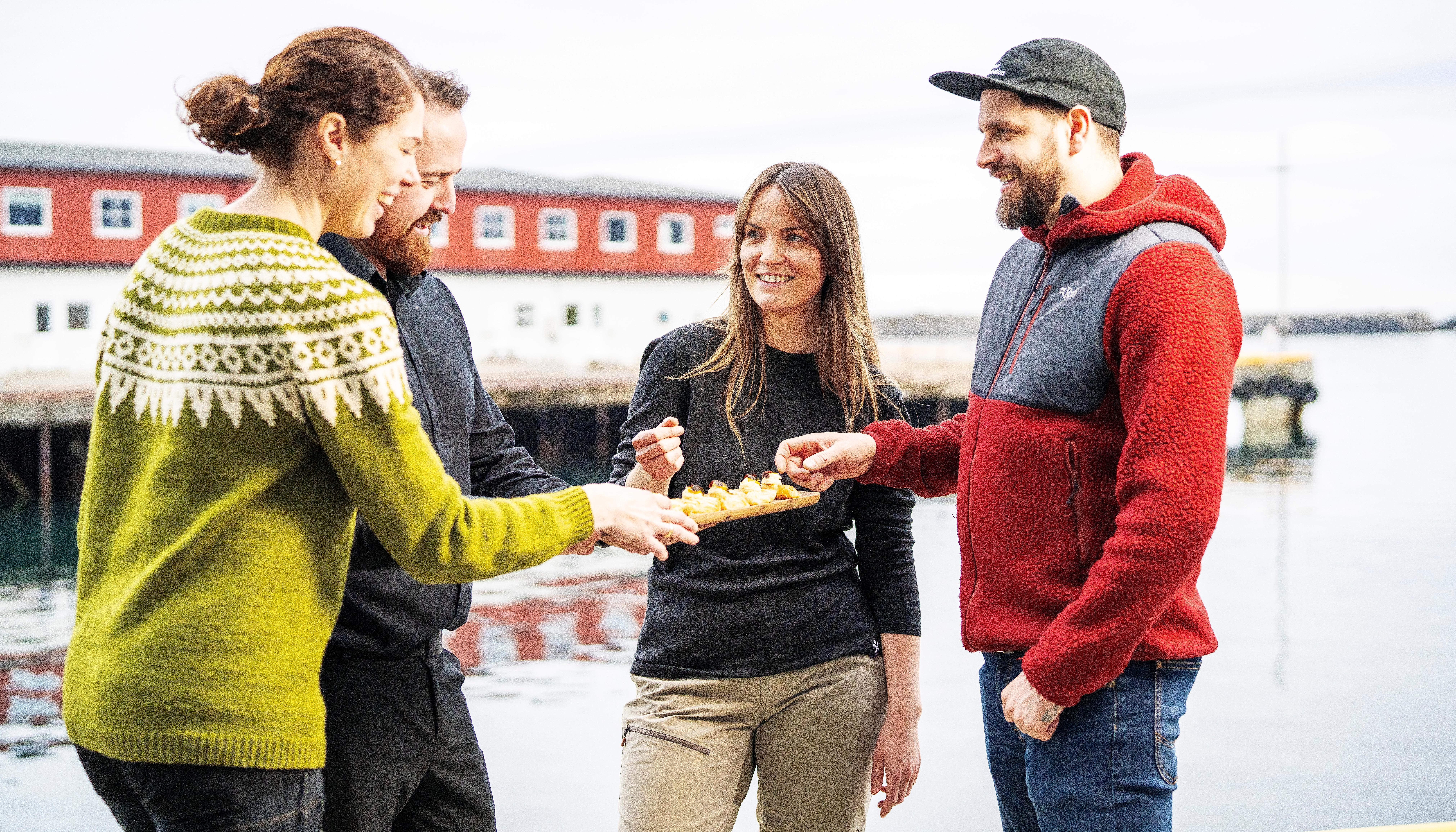 Tourists sharing a meal at the quay.