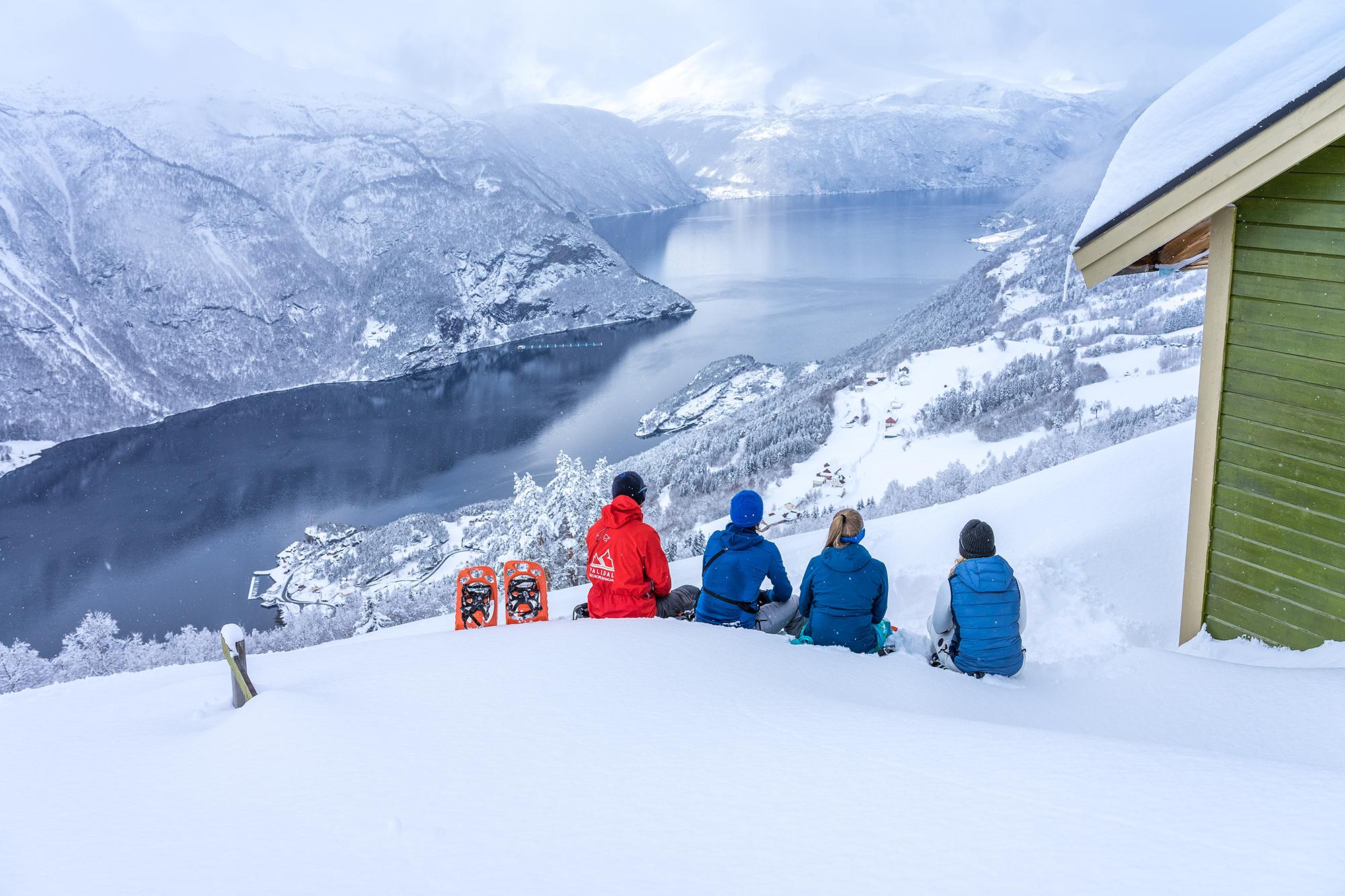 People taking a break from snowshoeing in Møre og Romsdal, Fjord Norway