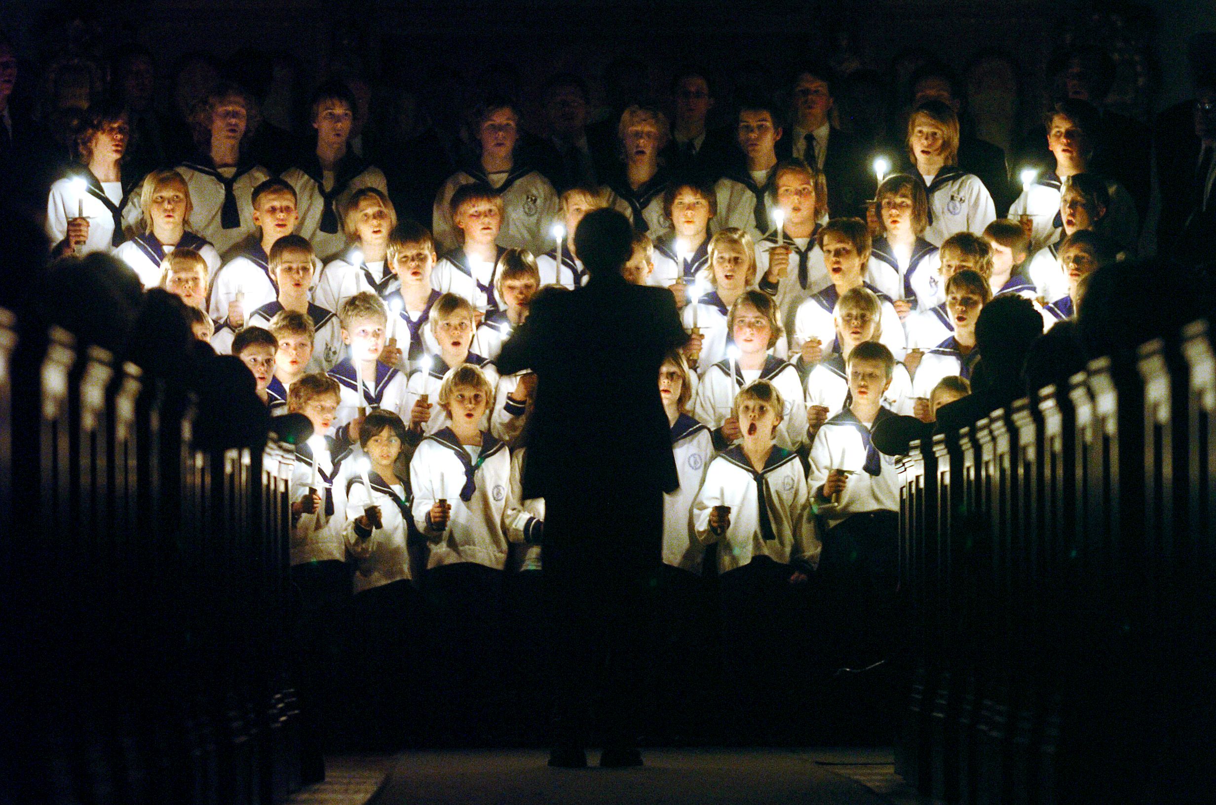 The boy choir is singing Christmas songs in a church in Oslo, Norway
