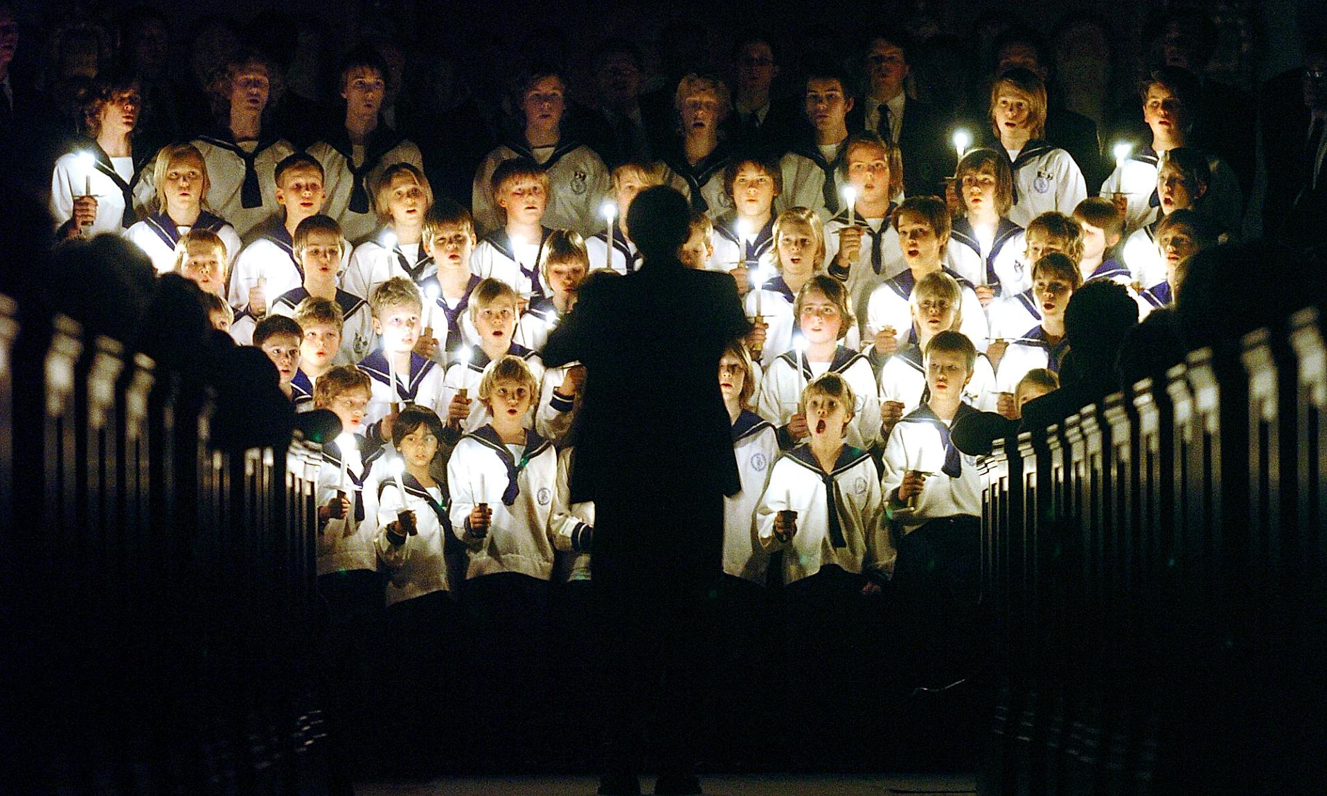 The boy choir is singing Christmas songs in a church in Oslo, Norway