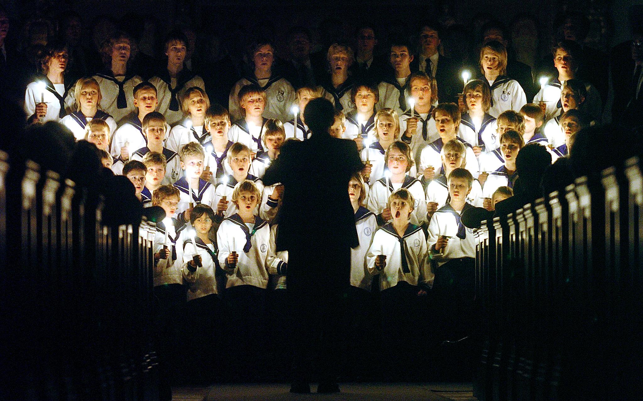 The boy choir is singing Christmas songs in a church in Oslo, Norway