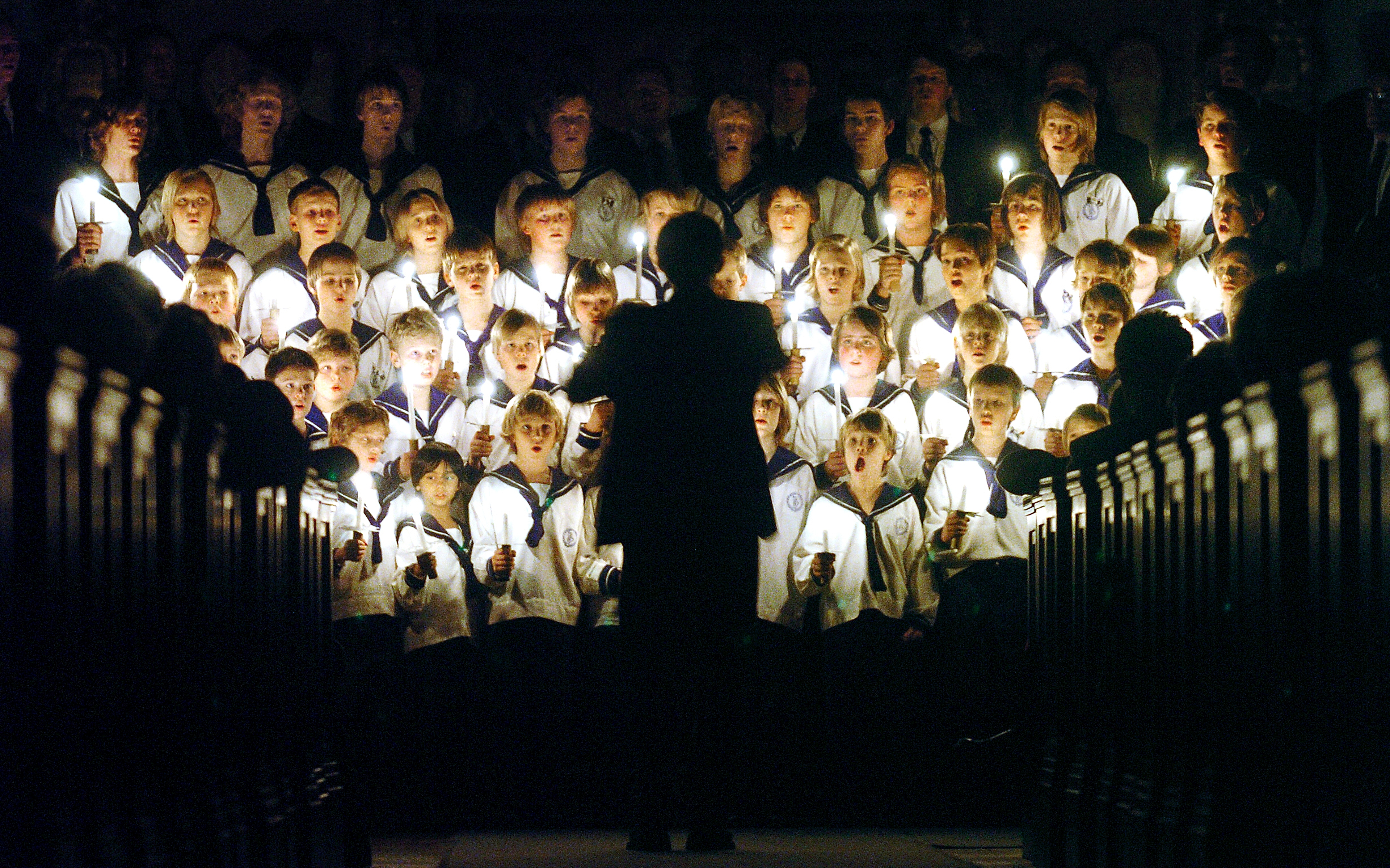 The boy choir is singing Christmas songs in a church in Oslo, Norway
