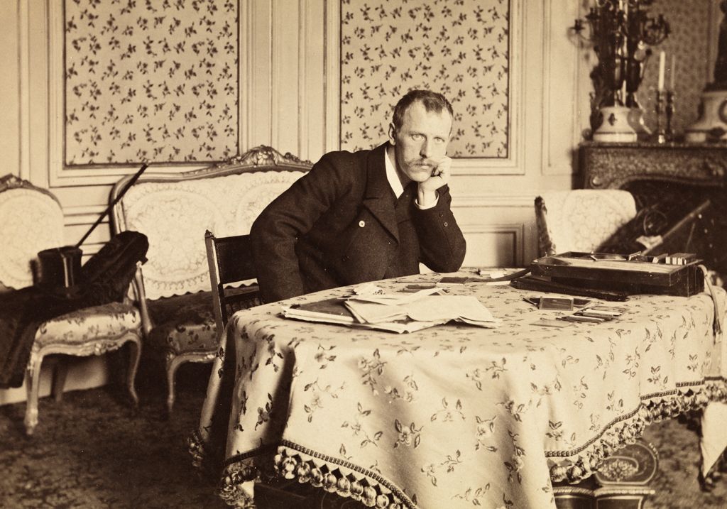 Fridtjof Nansen sitting at a table in Paris