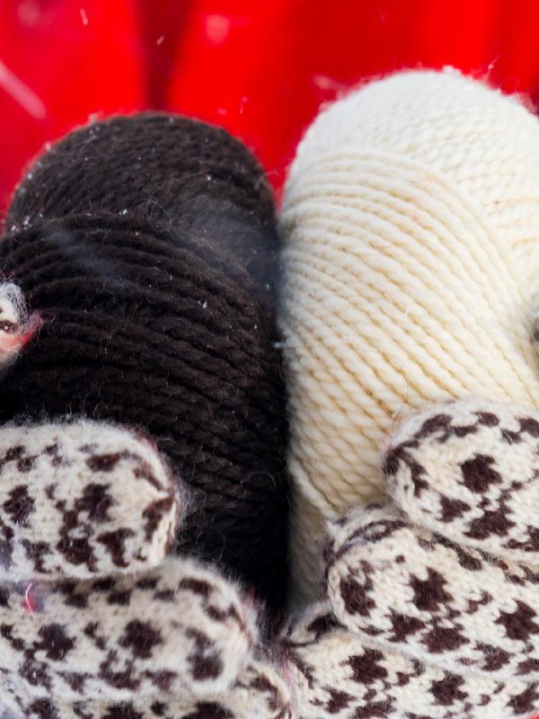A woman holding yarn used to make Selbu mittens, Trøndelag, Norway.