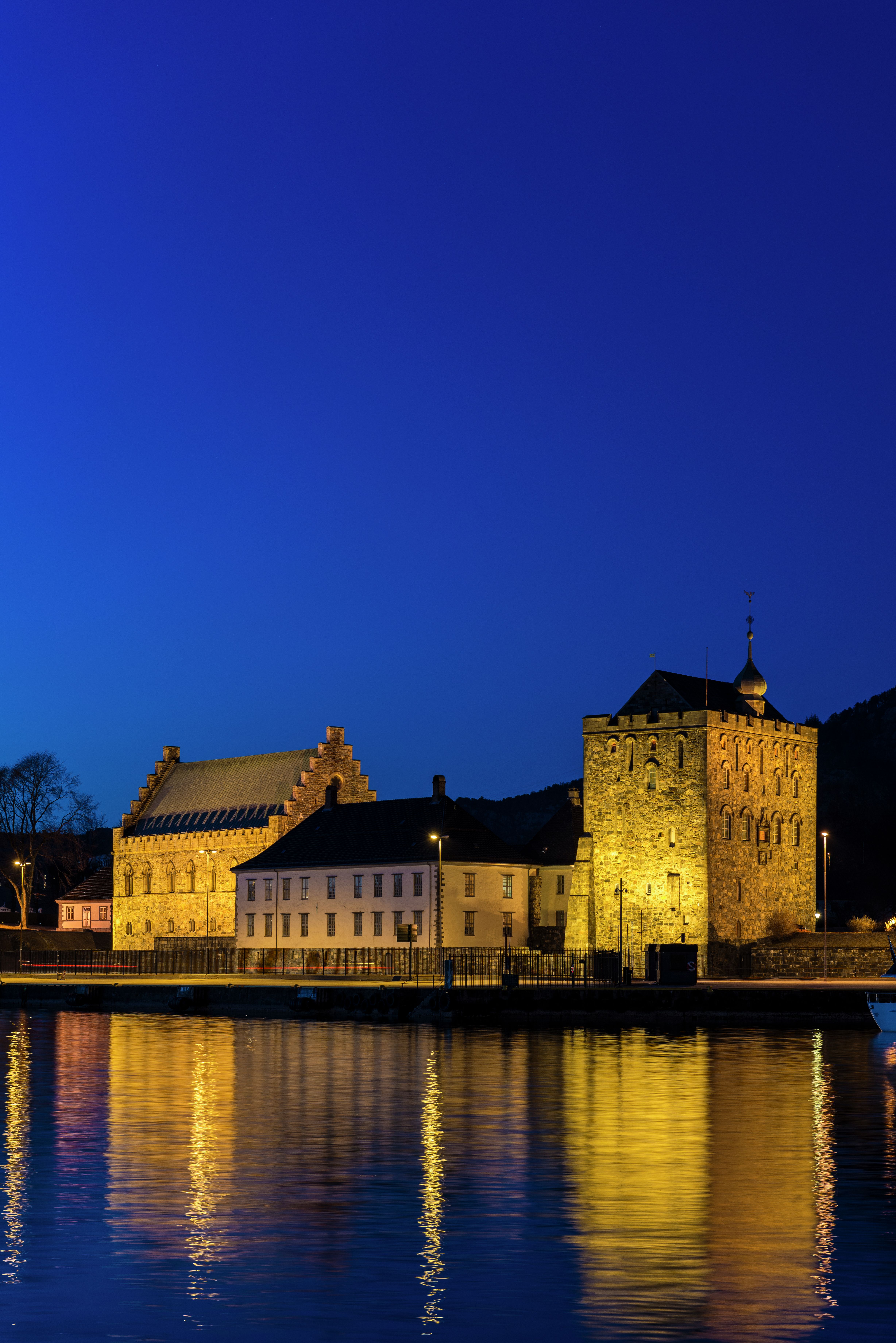 Bergenhus Fortress at night, viewed from across the river