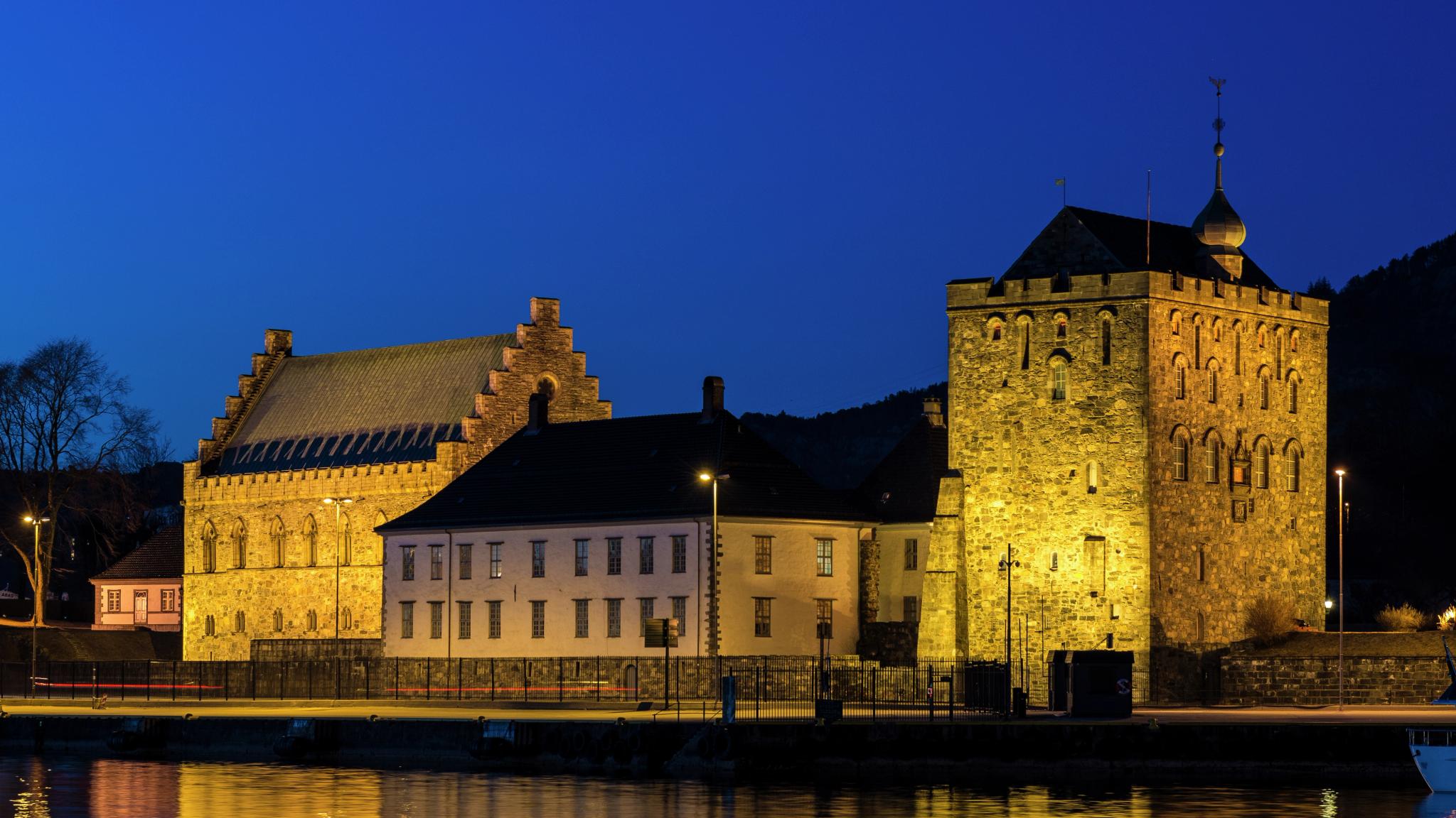 Bergenhus Fortress at night, viewed from across the river