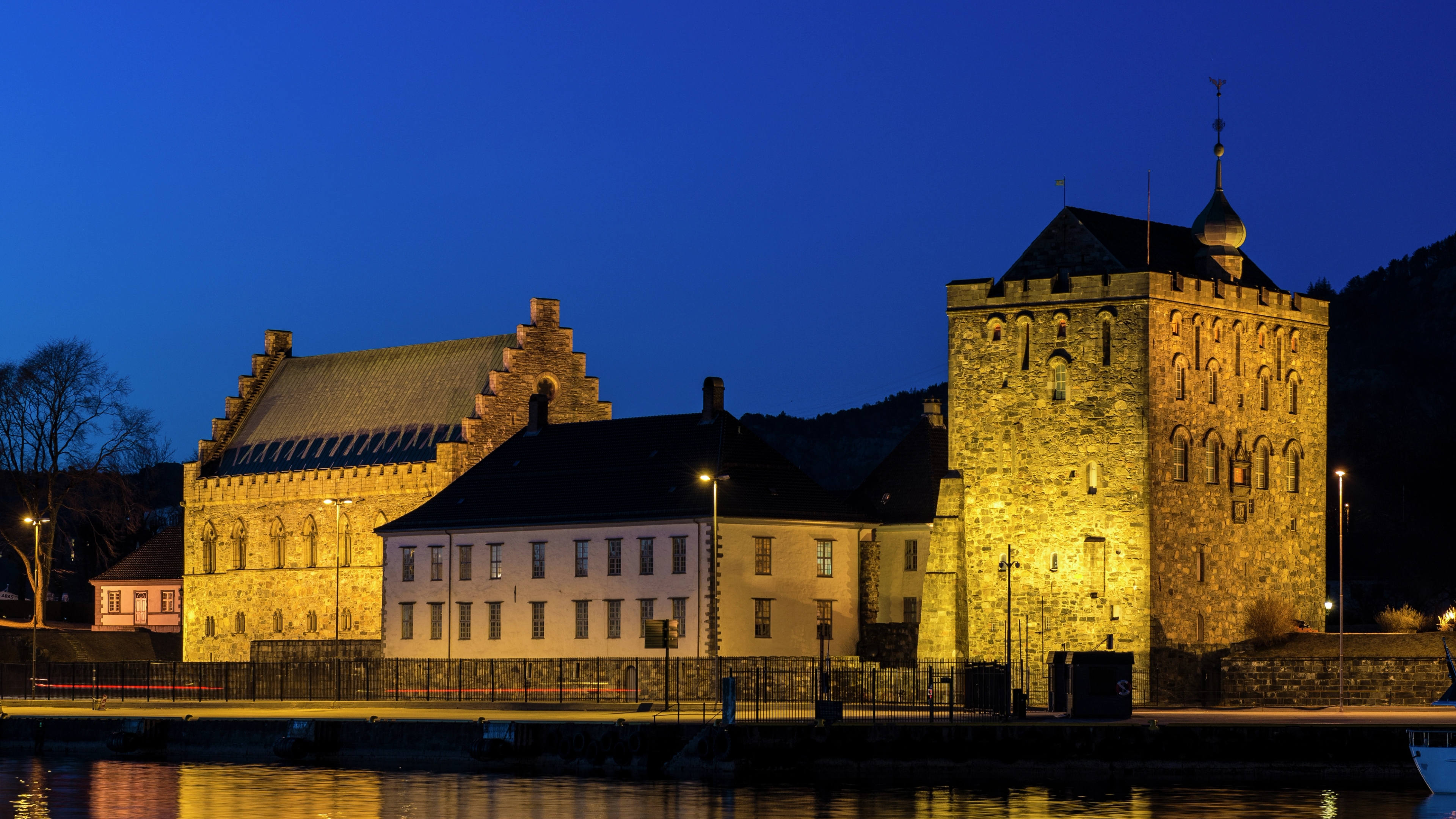 Bergenhus Fortress at night, viewed from across the river