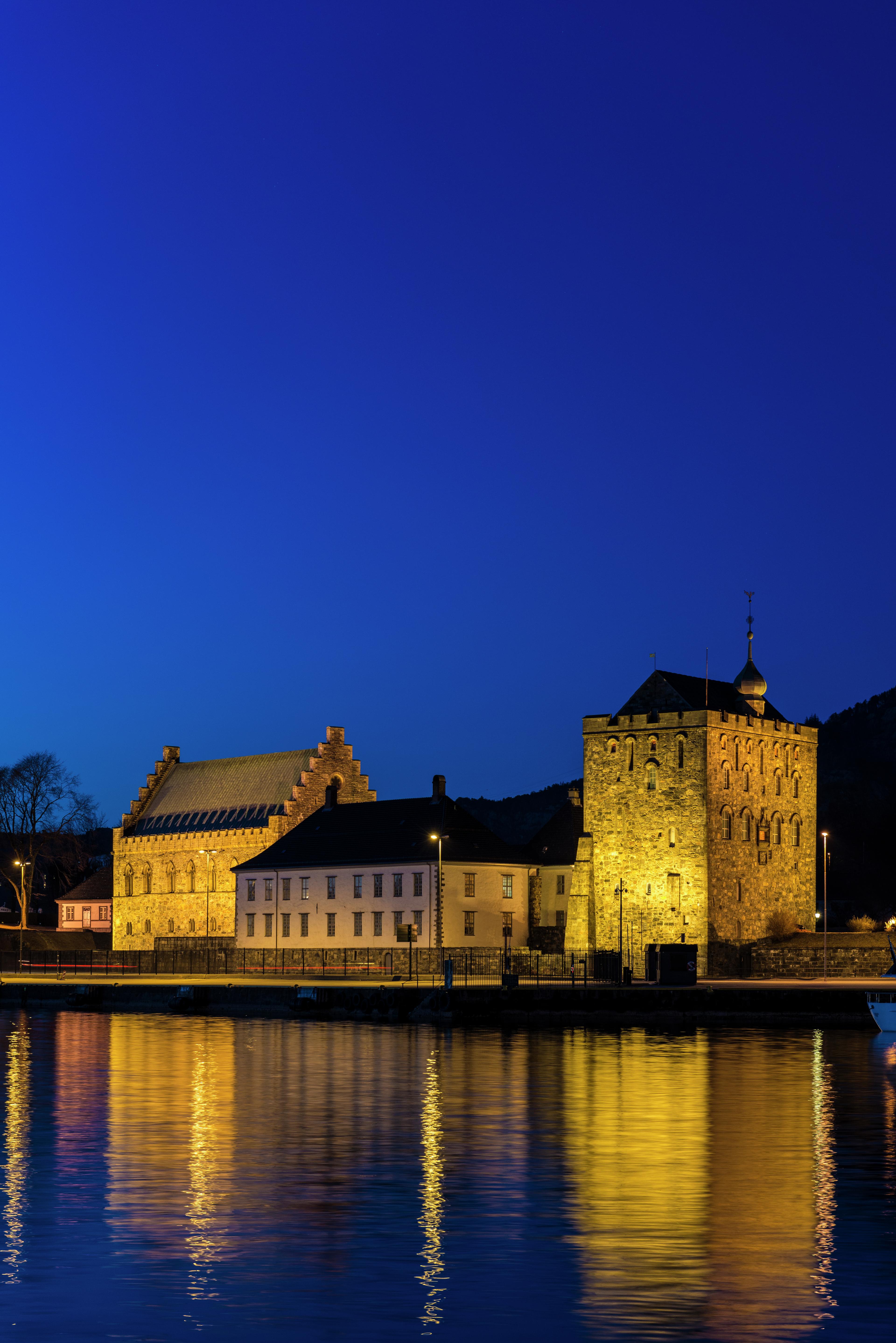 Bergenhus Fortress at night, viewed from across the river