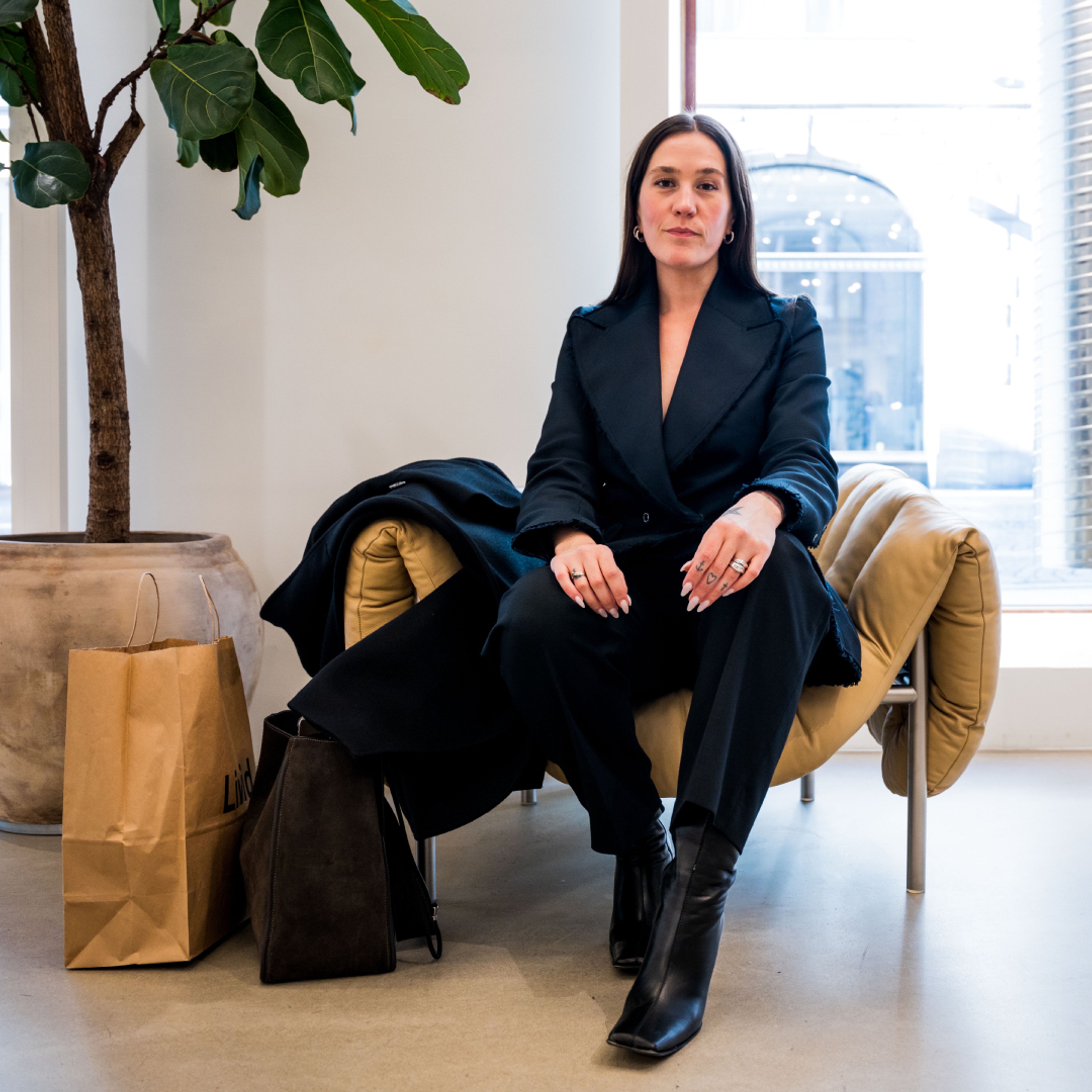 Ida Elise Eide Einarsdottir sitting in a chair at Tom Wood