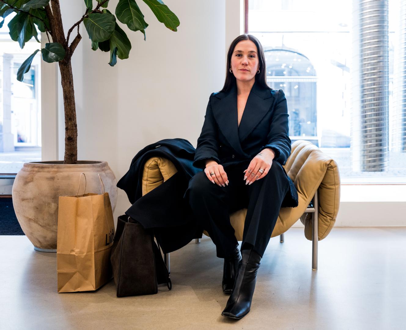 Ida Elise Eide Einarsdottir sitting in a chair at Tom Wood