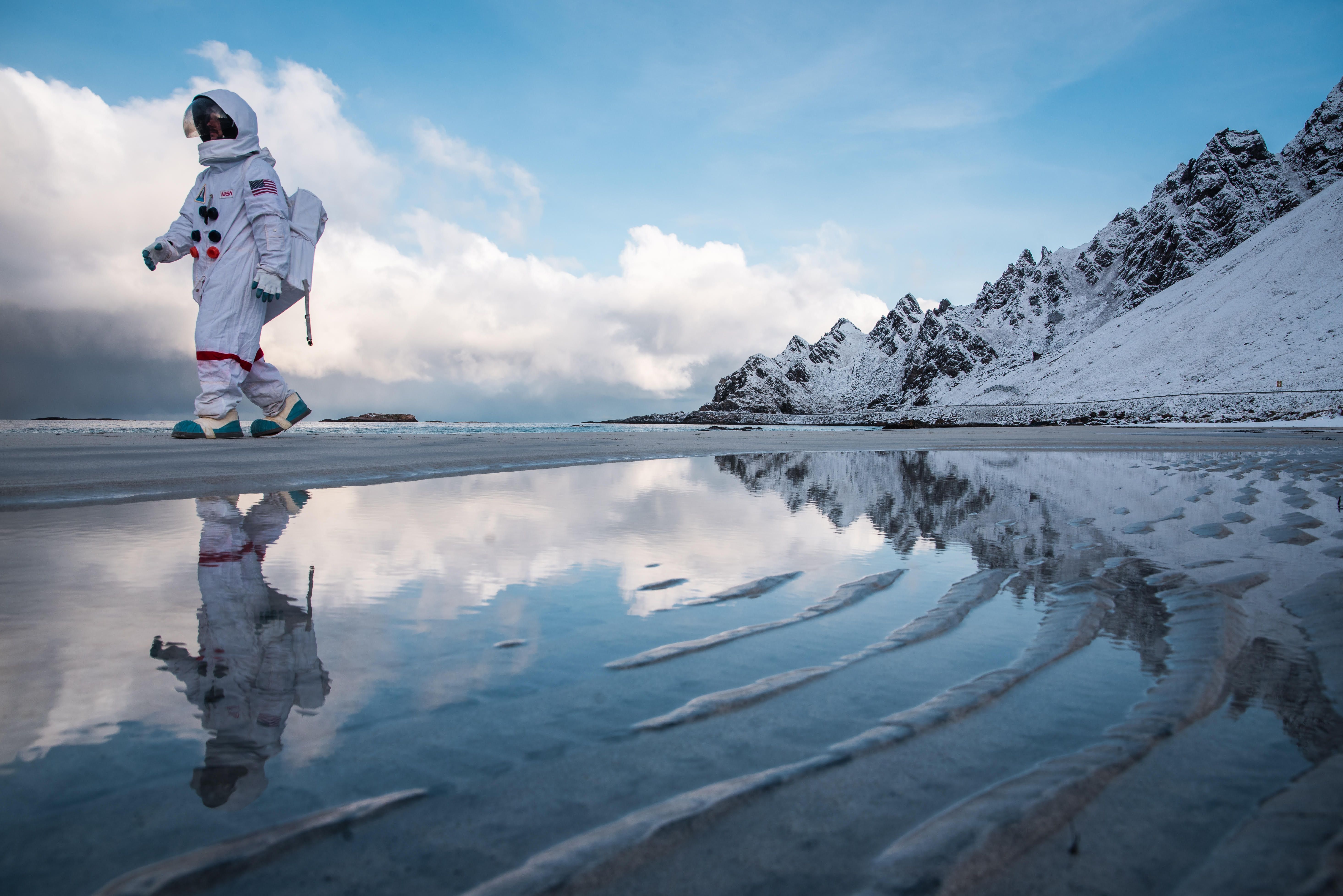 An "astronaut" from Andøya Space walking along Bleikstranda beach at Andøya
