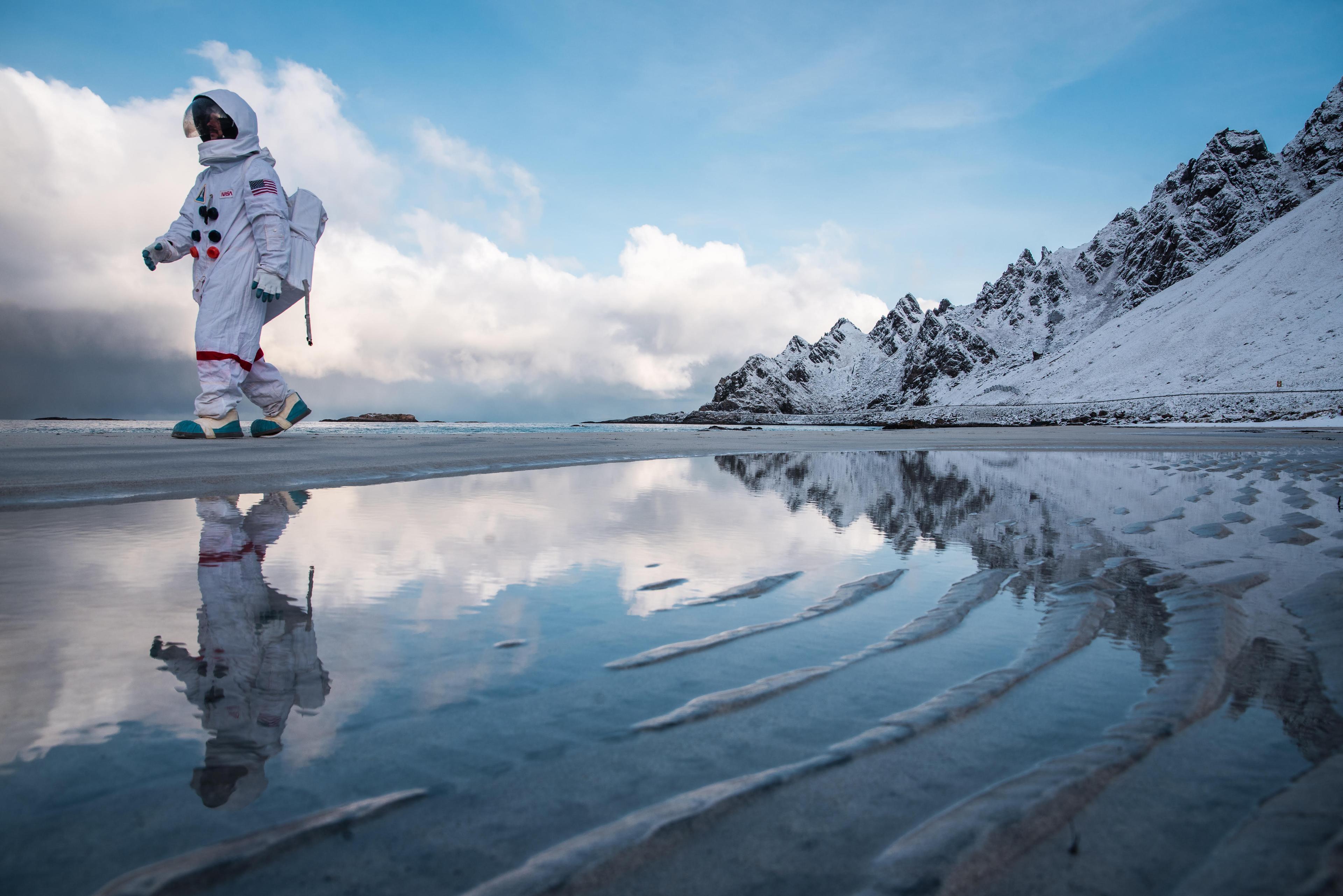 An "astronaut" from Andøya Space walking along Bleikstranda beach at Andøya