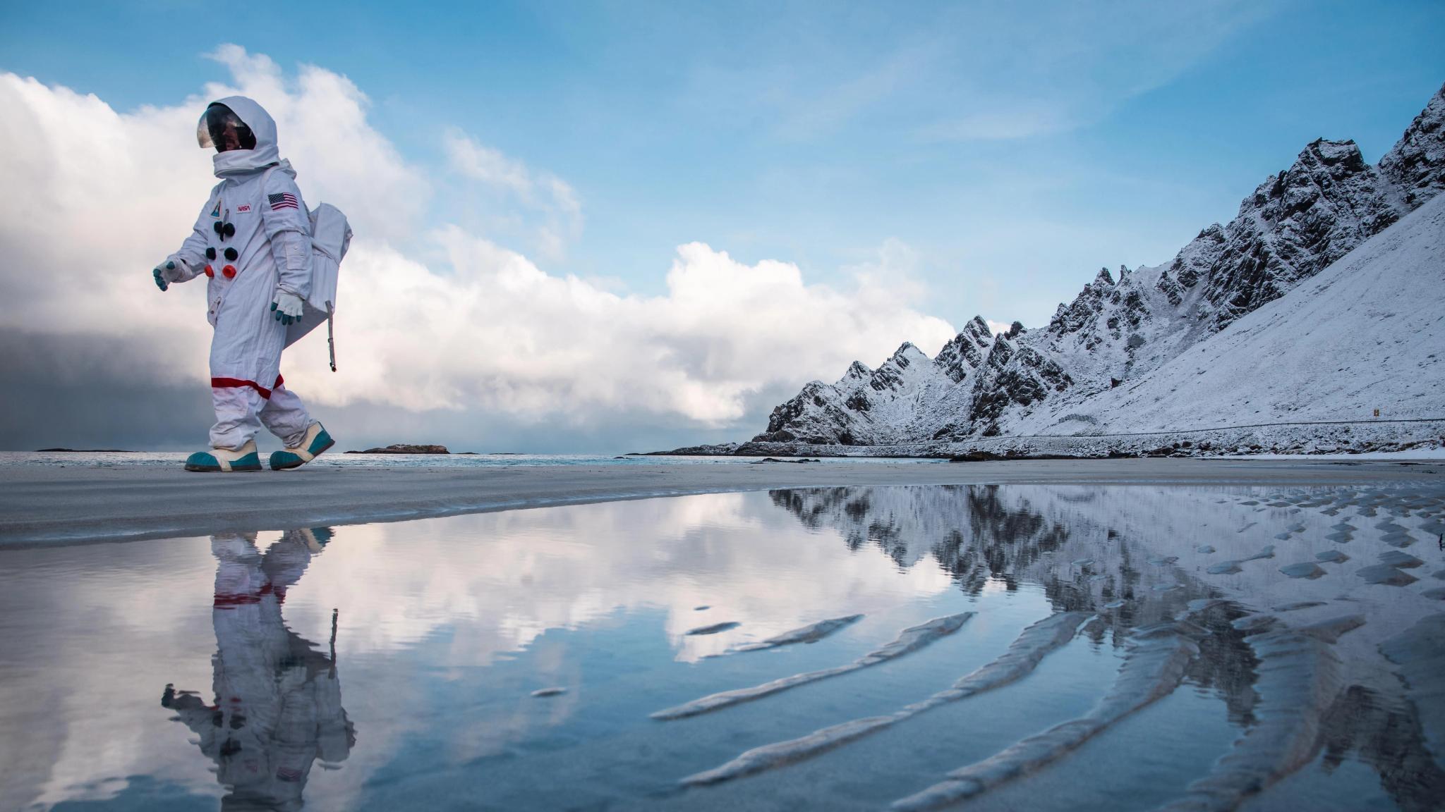 An "astronaut" from Andøya Space walking along Bleikstranda beach at Andøya