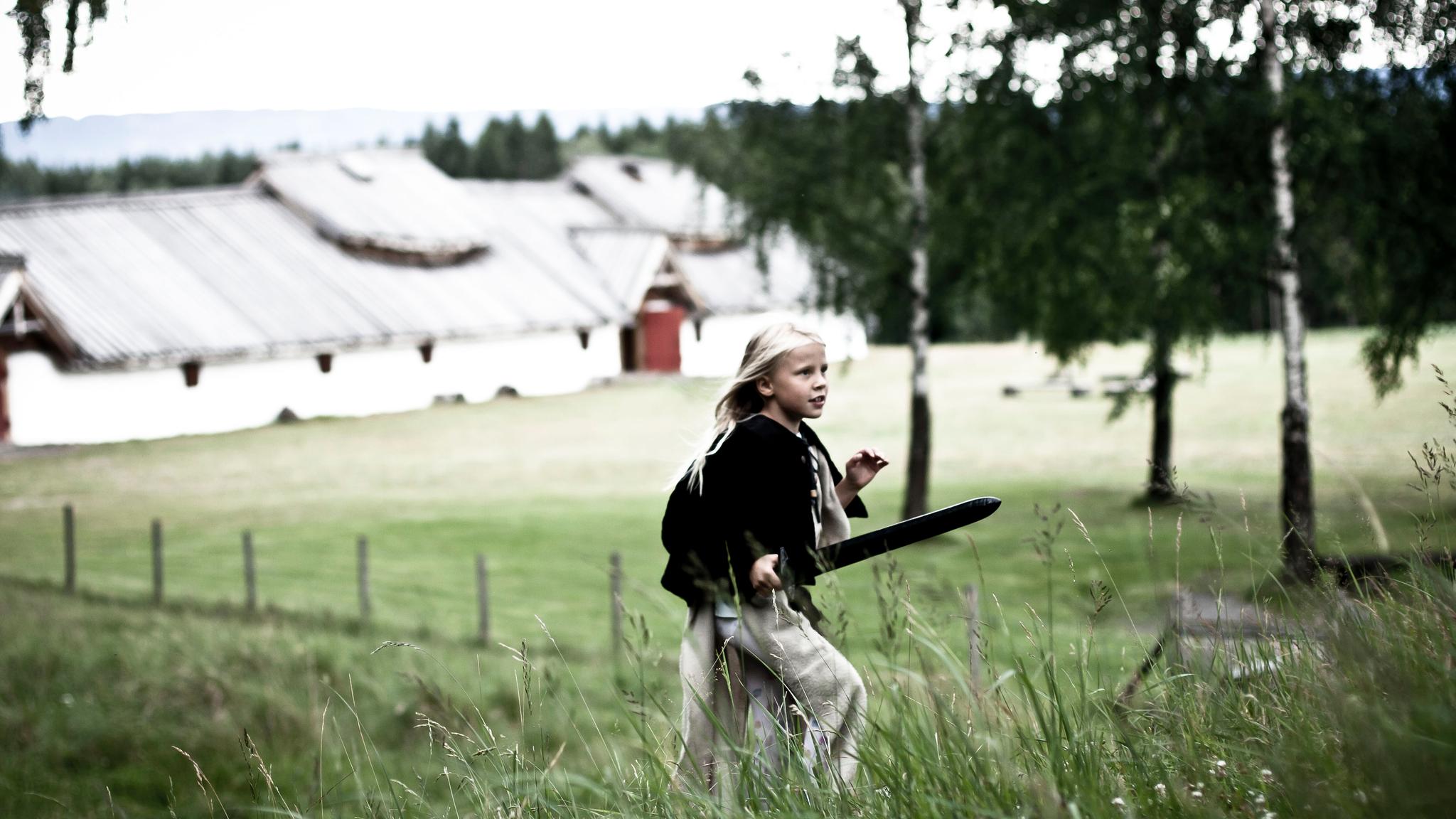 A girl playing in Veien Kulturminnepark in Ringerike, Eastern Norway