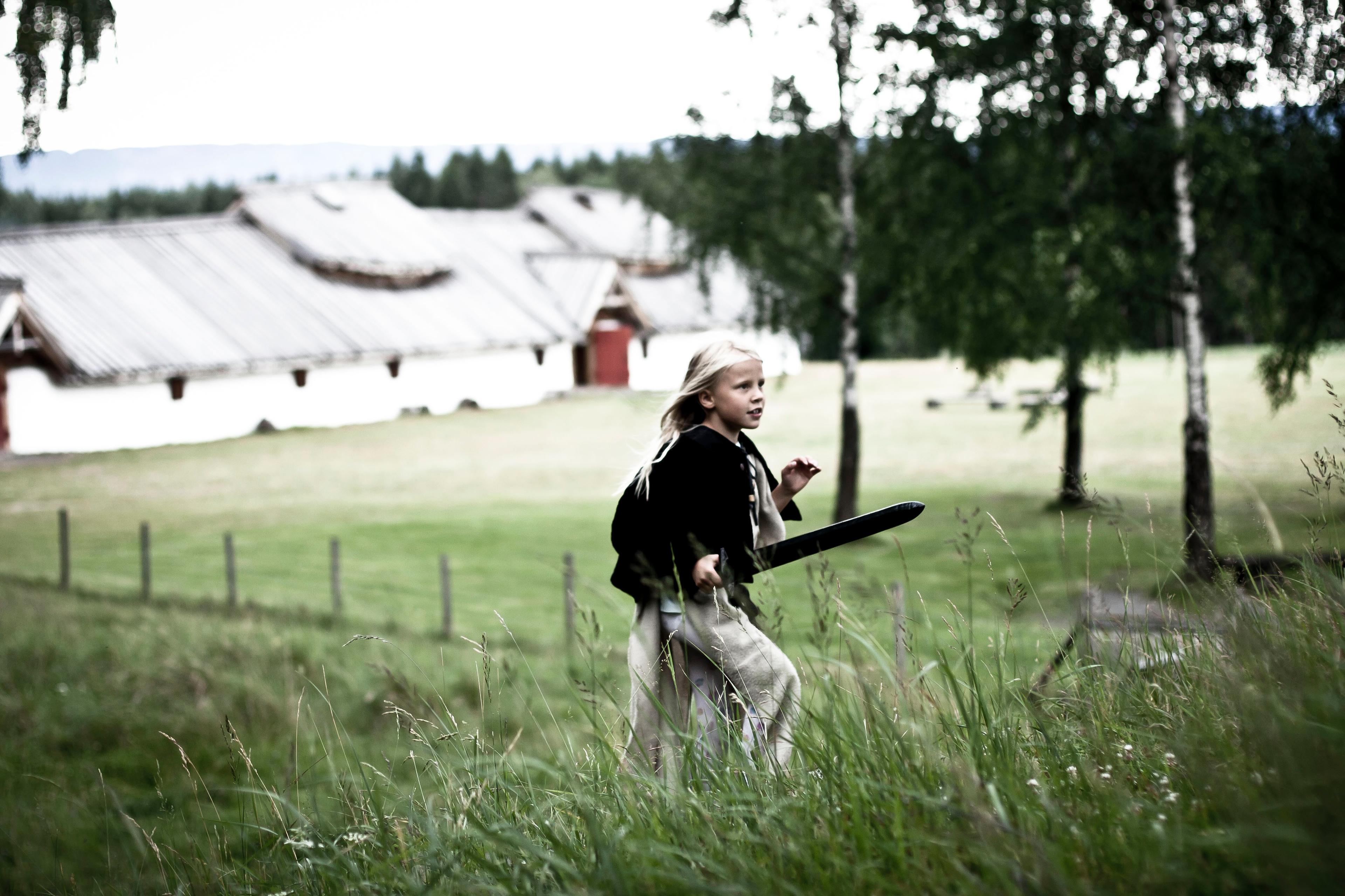 A girl playing in Veien Kulturminnepark in Ringerike, Eastern Norway