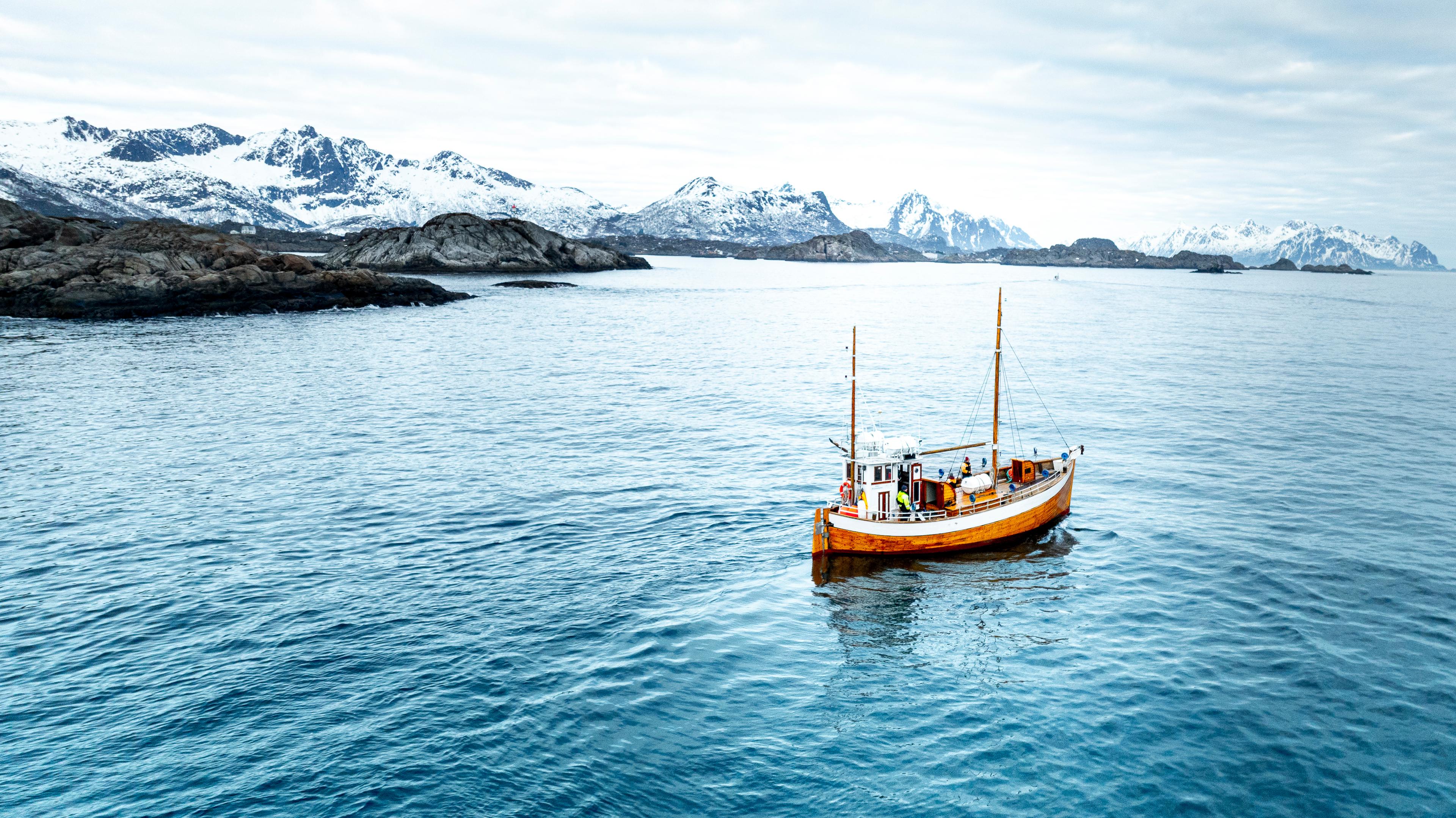 An old fishingboat out at sea in Lofoten