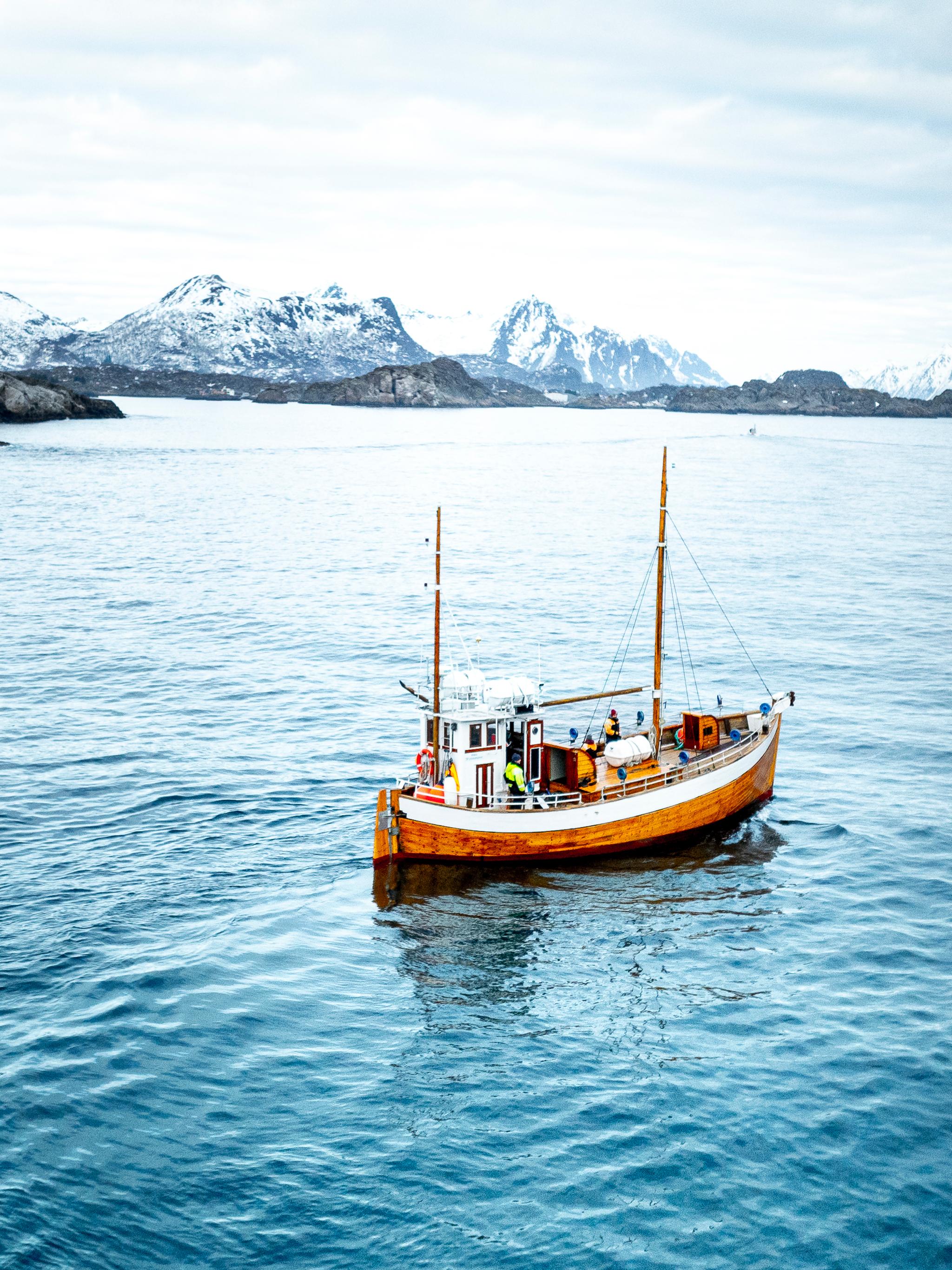 An old fishingboat out at sea in Lofoten