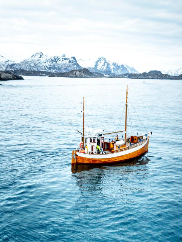 An old fishingboat out at sea in Lofoten