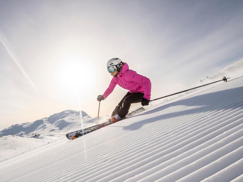 A woman skiing down an alpine slope in Hemsedal in Eastern Norway