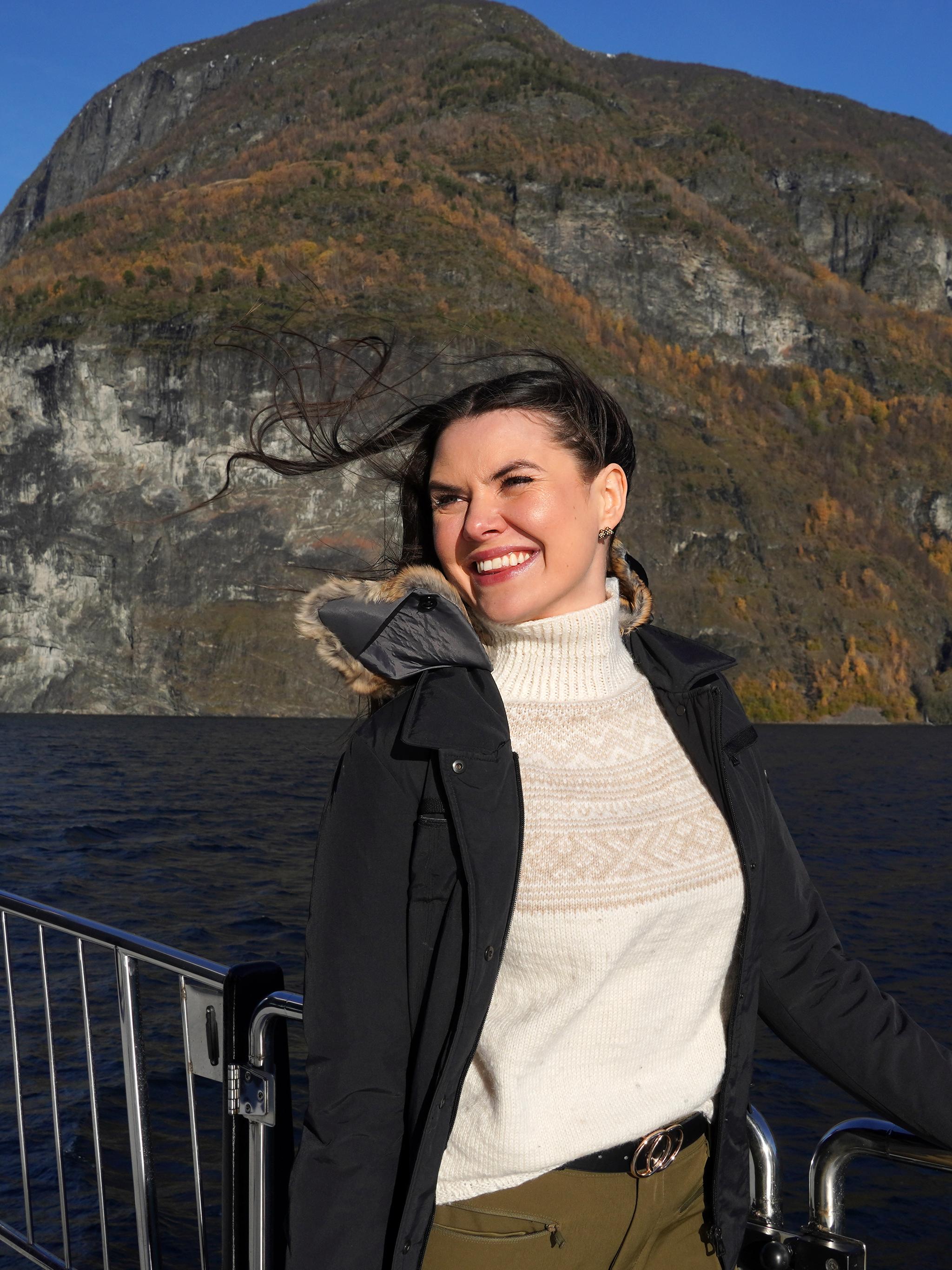 Woman on a cruise in a fjord.
