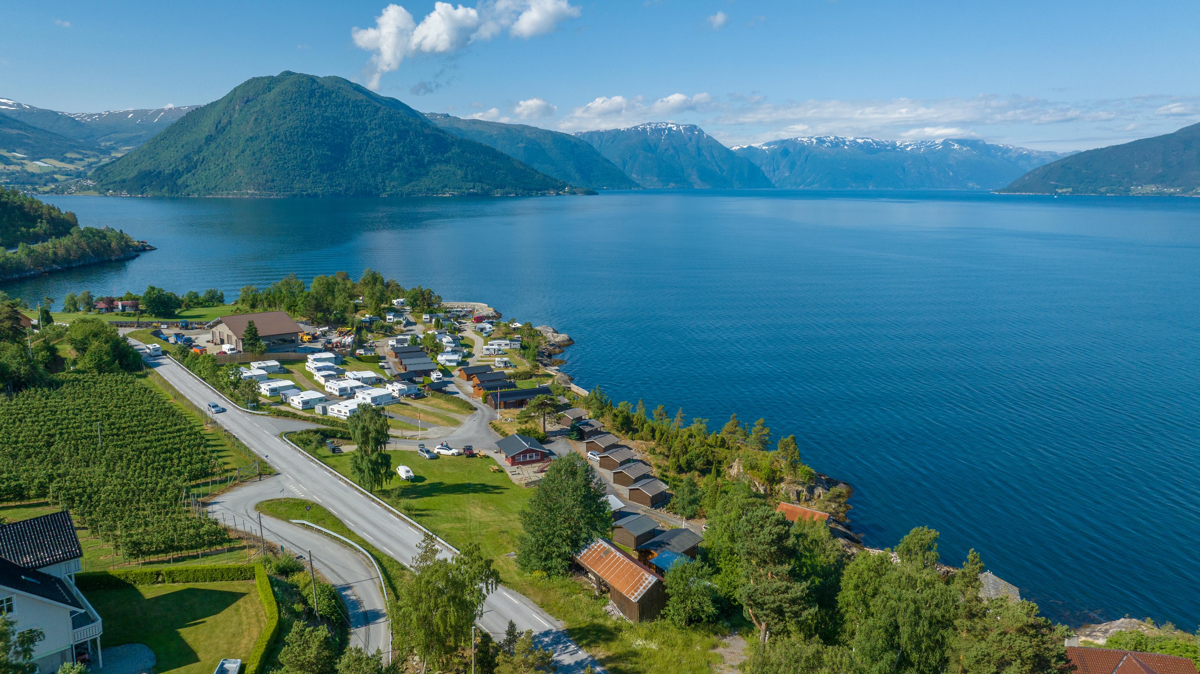 Overview of Djuvik camping with the fjord in the backround