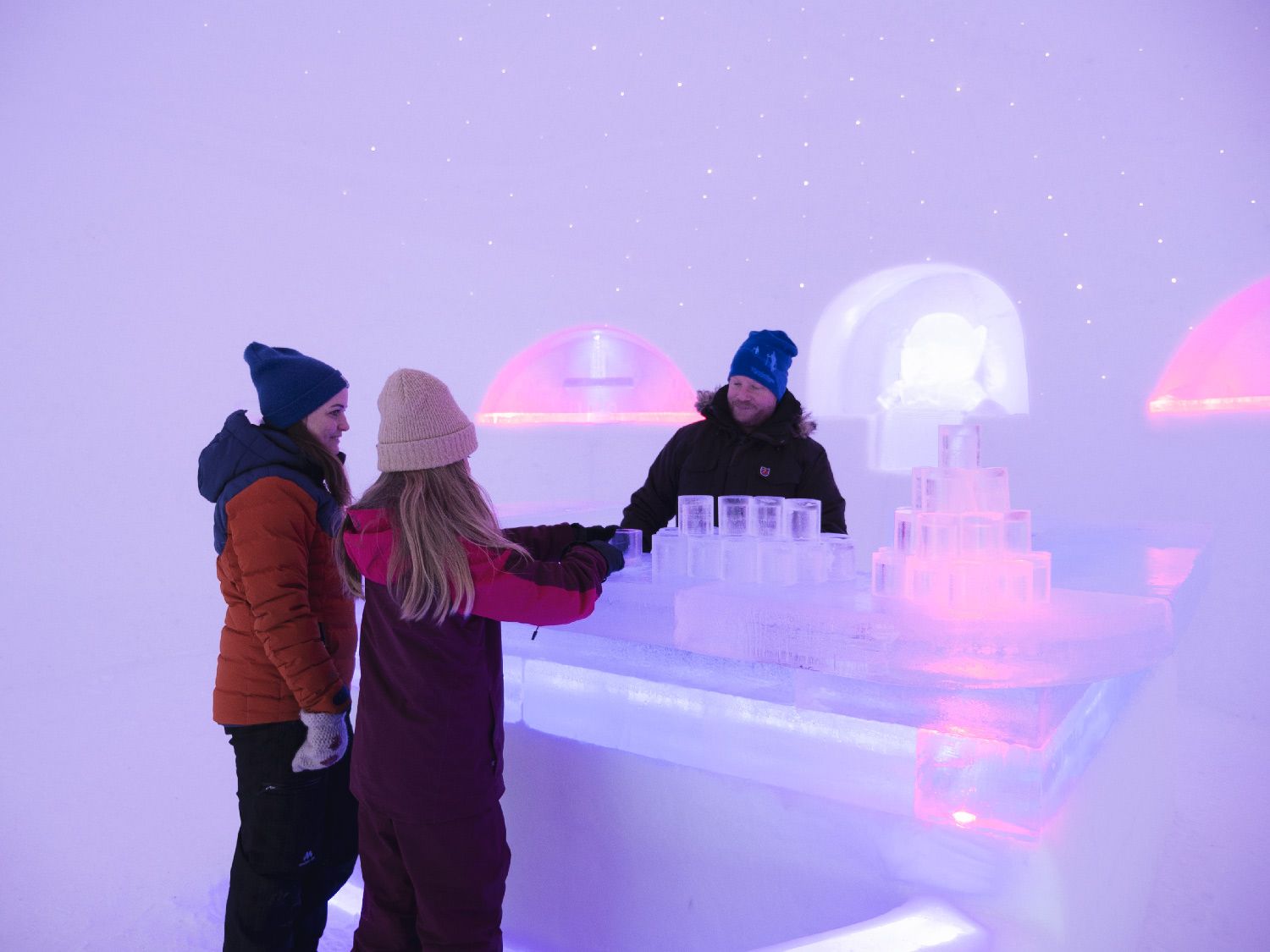 Three people in the bar at Hunderfossen Snow Hotel