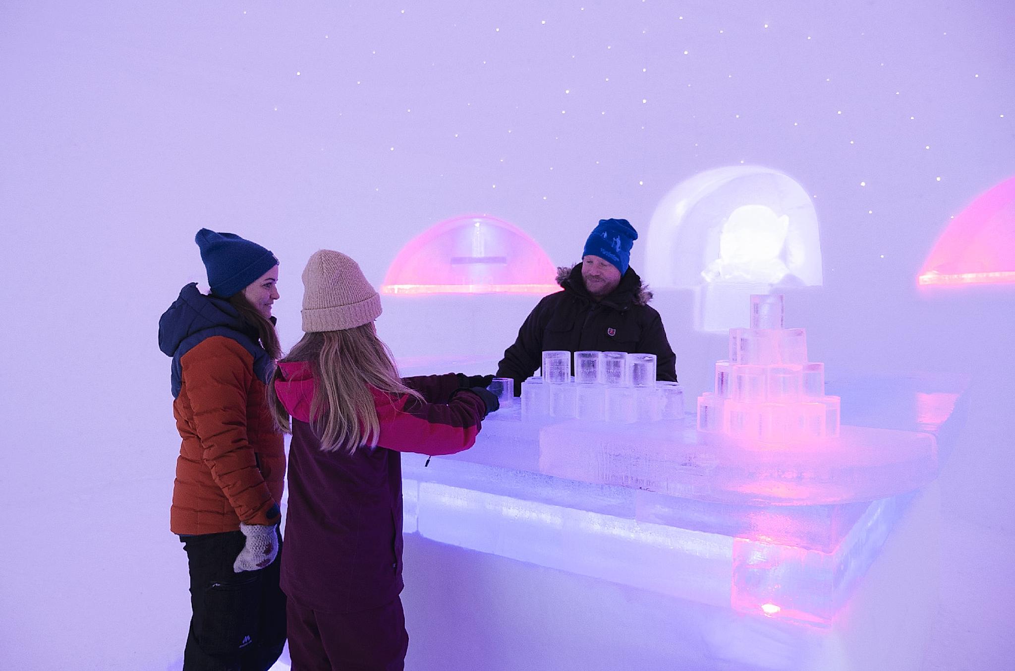 Three people in the bar at Hunderfossen Snow Hotel