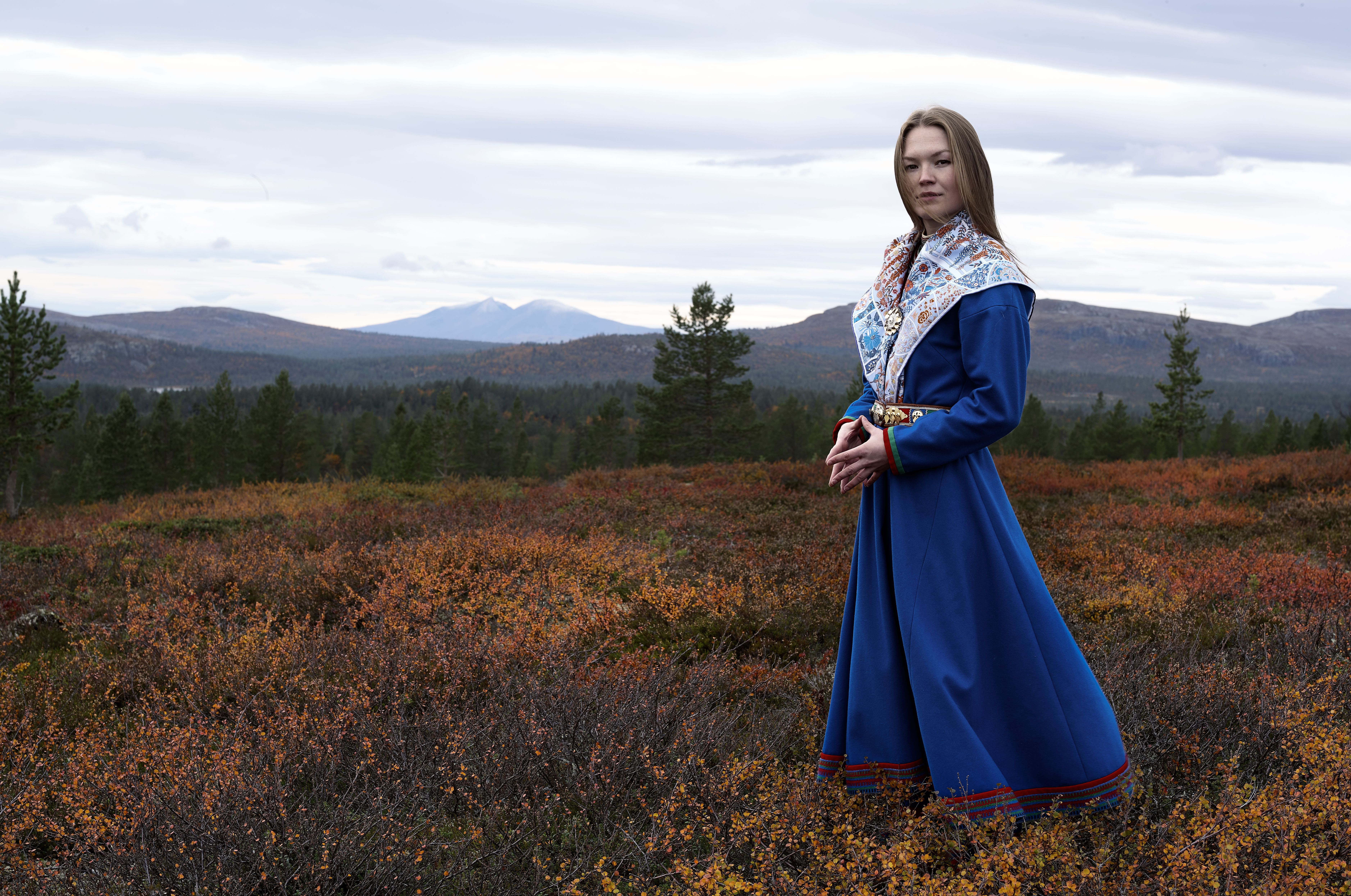 Portrait of Marja Mortensson in a sami dress.