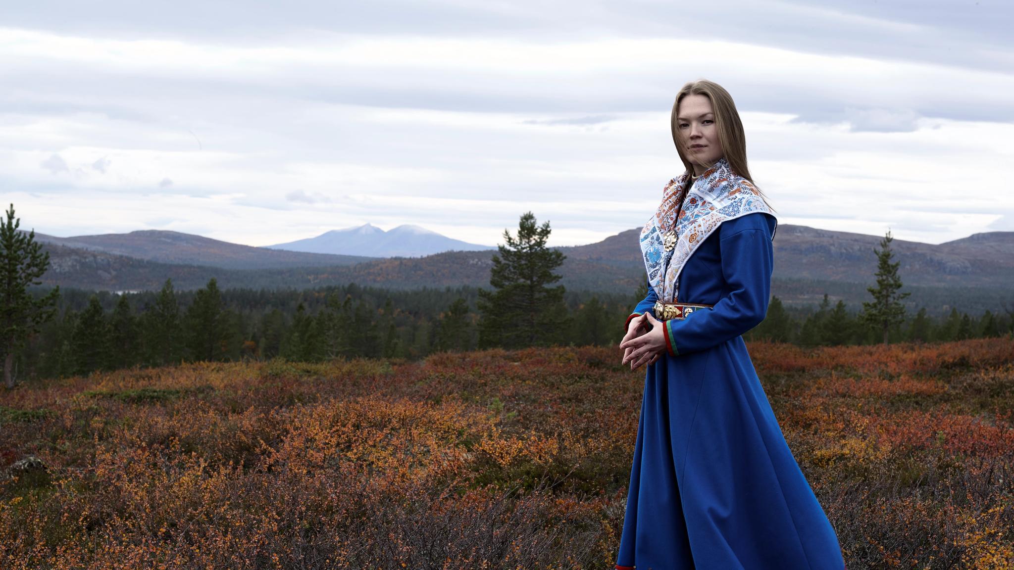 Portrait of Marja Mortensson in a sami dress.