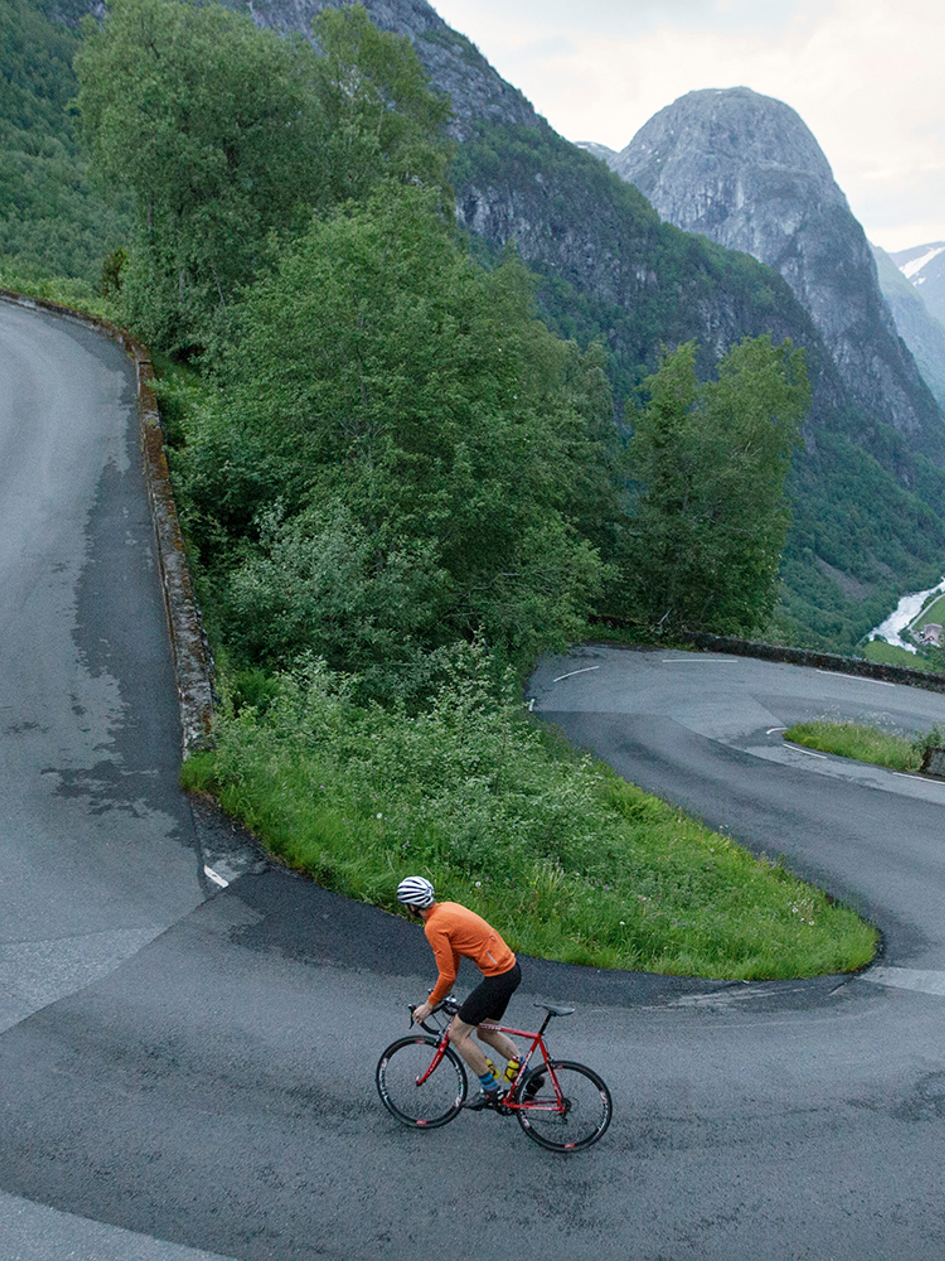 A person road cycling up Stalheimskleiva in Voss in Fjord Norway, one of the top 5 cycling routes in the mountains